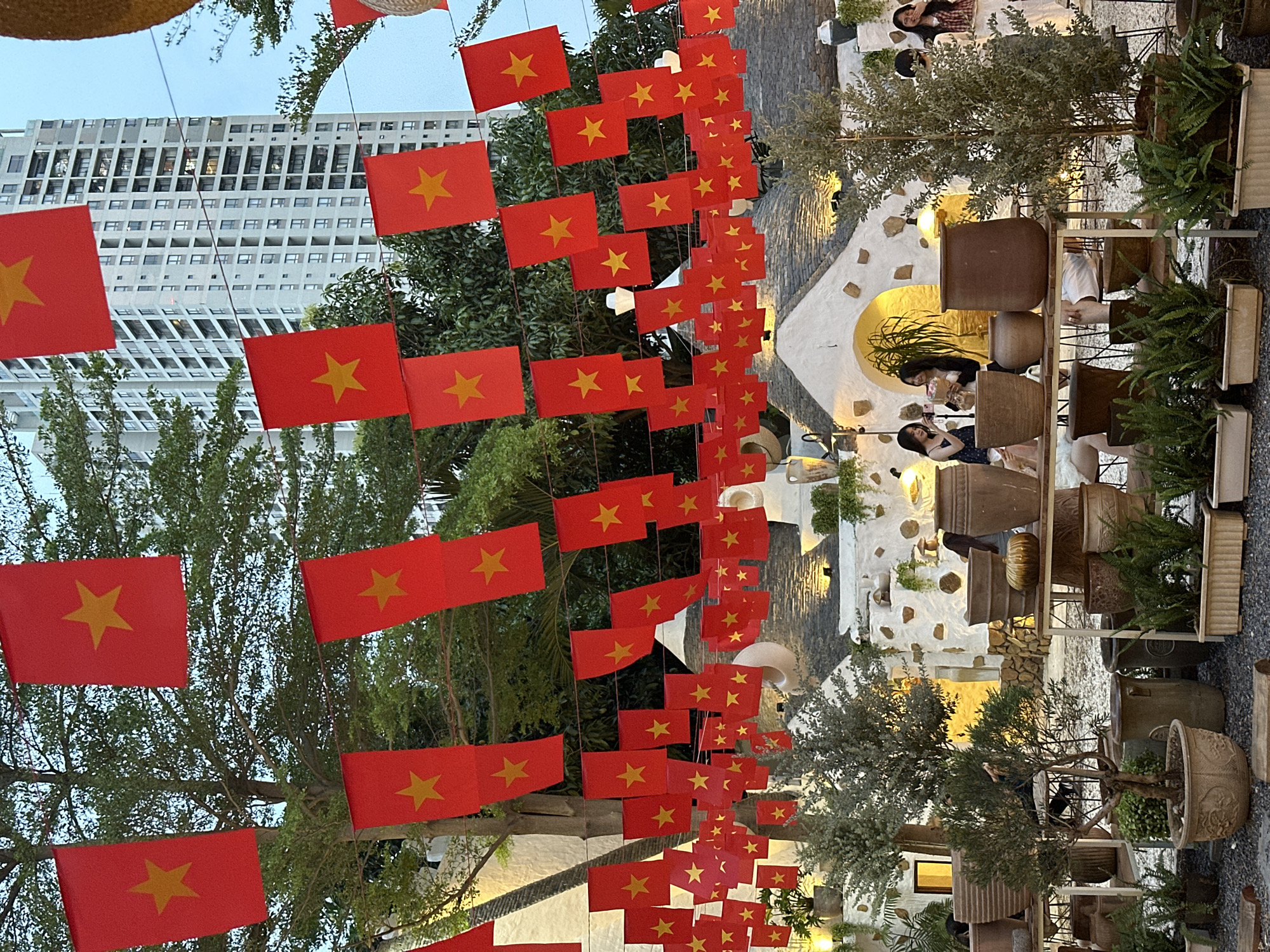 Vietnamese flags decorate Italian-style café district in Thủ Đức