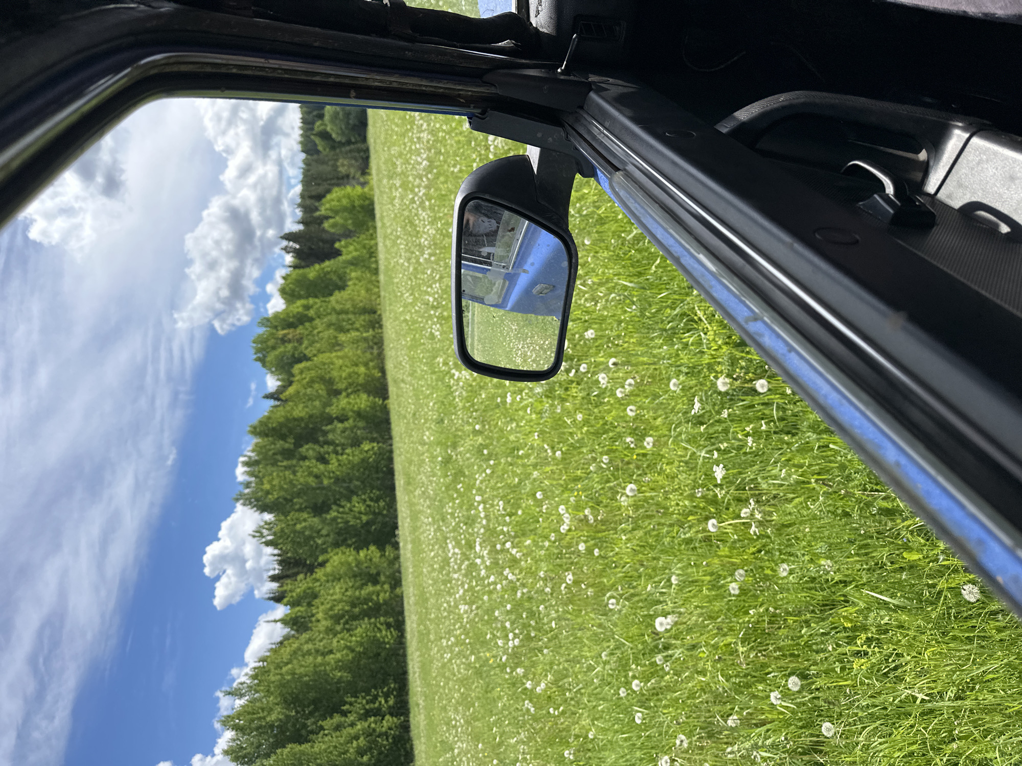 Driver captures sunny rural landscape view in Ilyinsky, Russia
