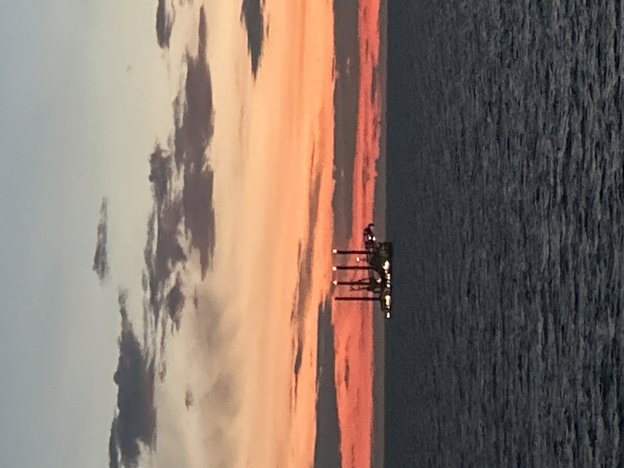 Maritime sunset observed with gradient sky colors