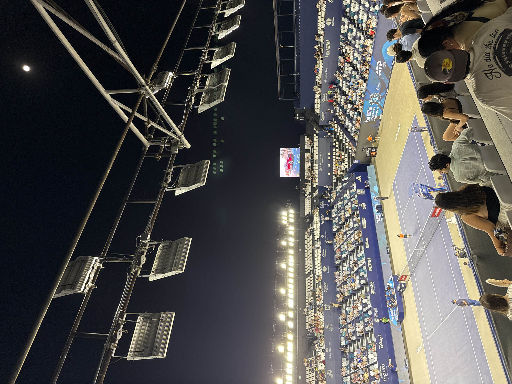 Los Cabos Open stadium glowing under floodlights at night