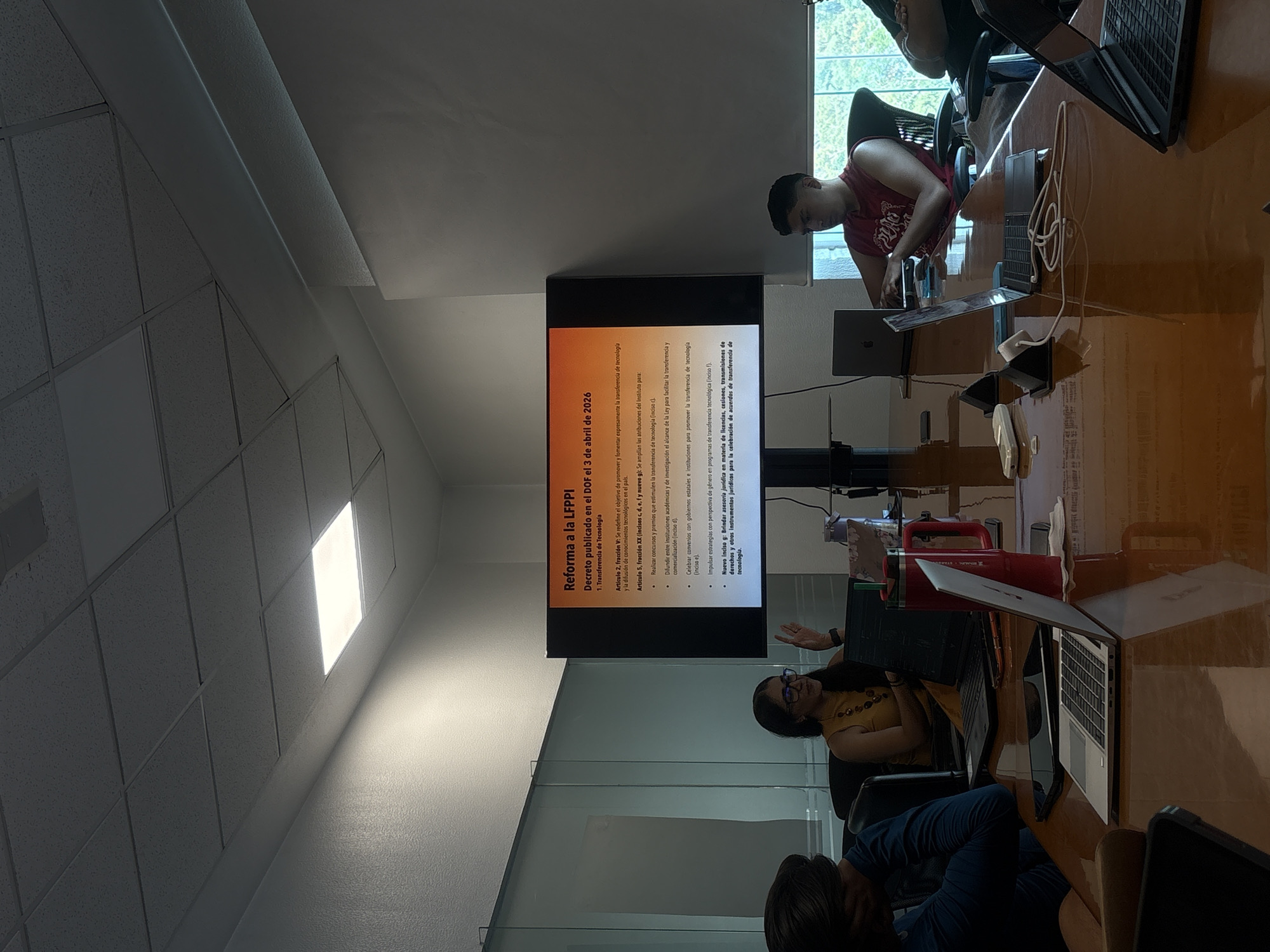 Evening business meeting documented in Puebla office conference room