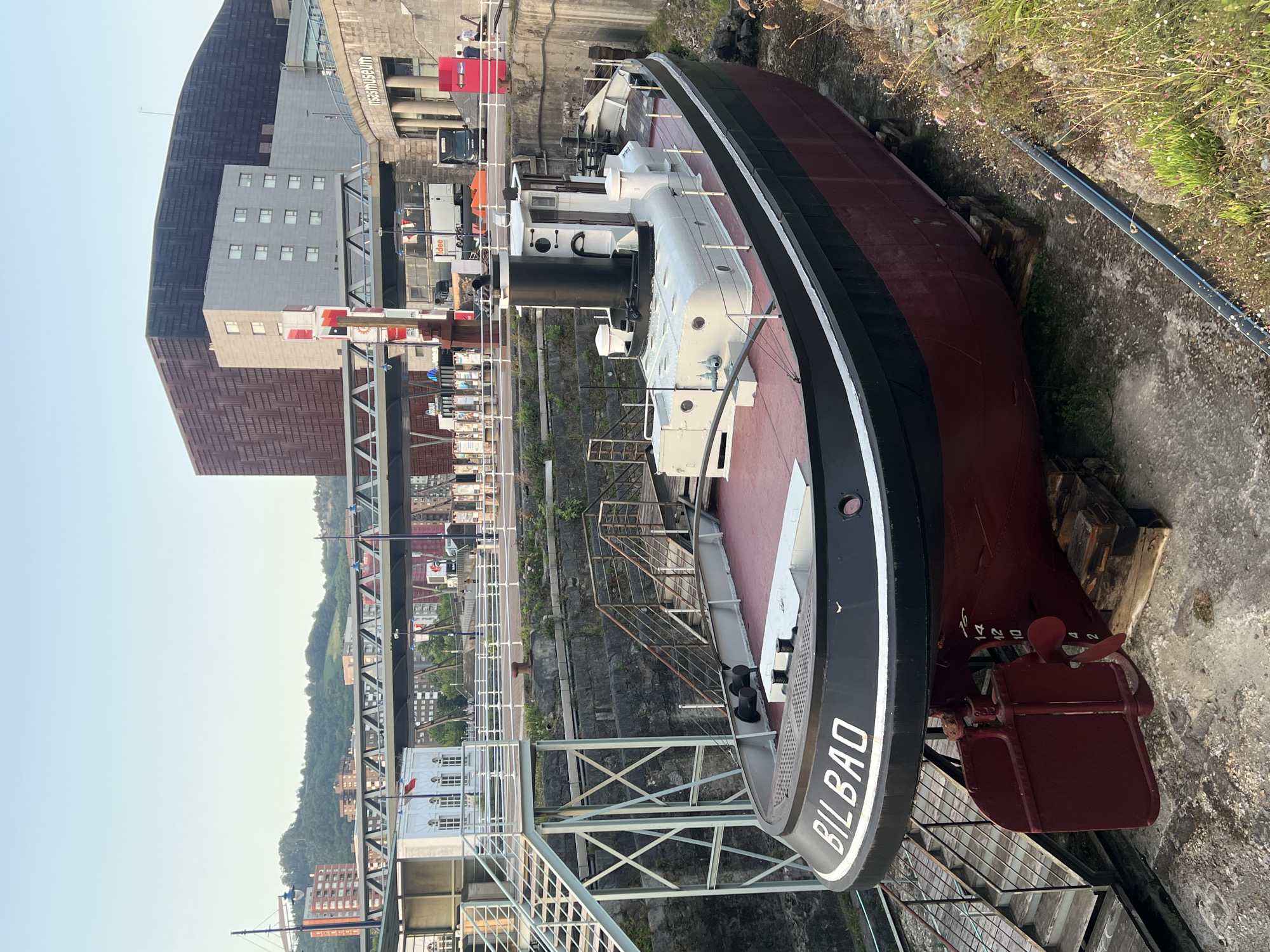 Bilbao's waterfront, shipyard, and stadium at golden hour