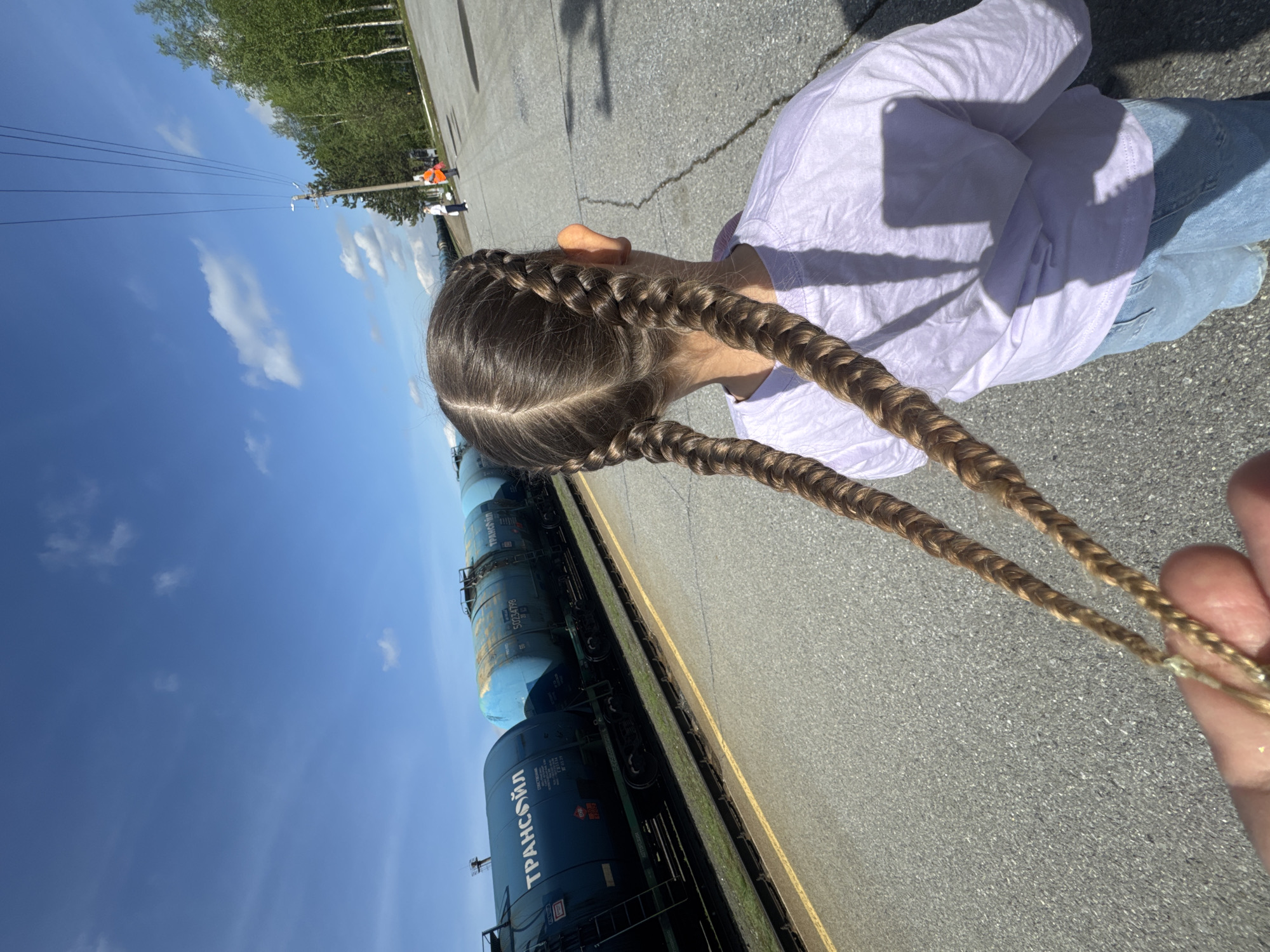 Sunny morning scenes documented along railway in Vysoky, Russia