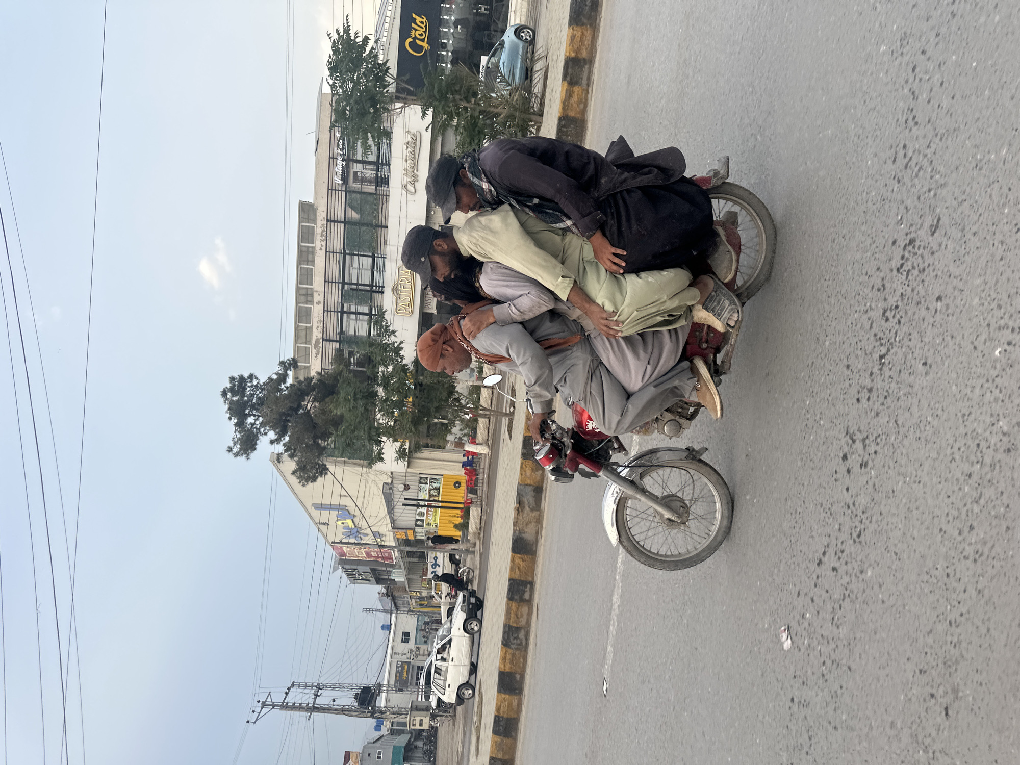 Multiple riders share motorcycles on Quetta streets