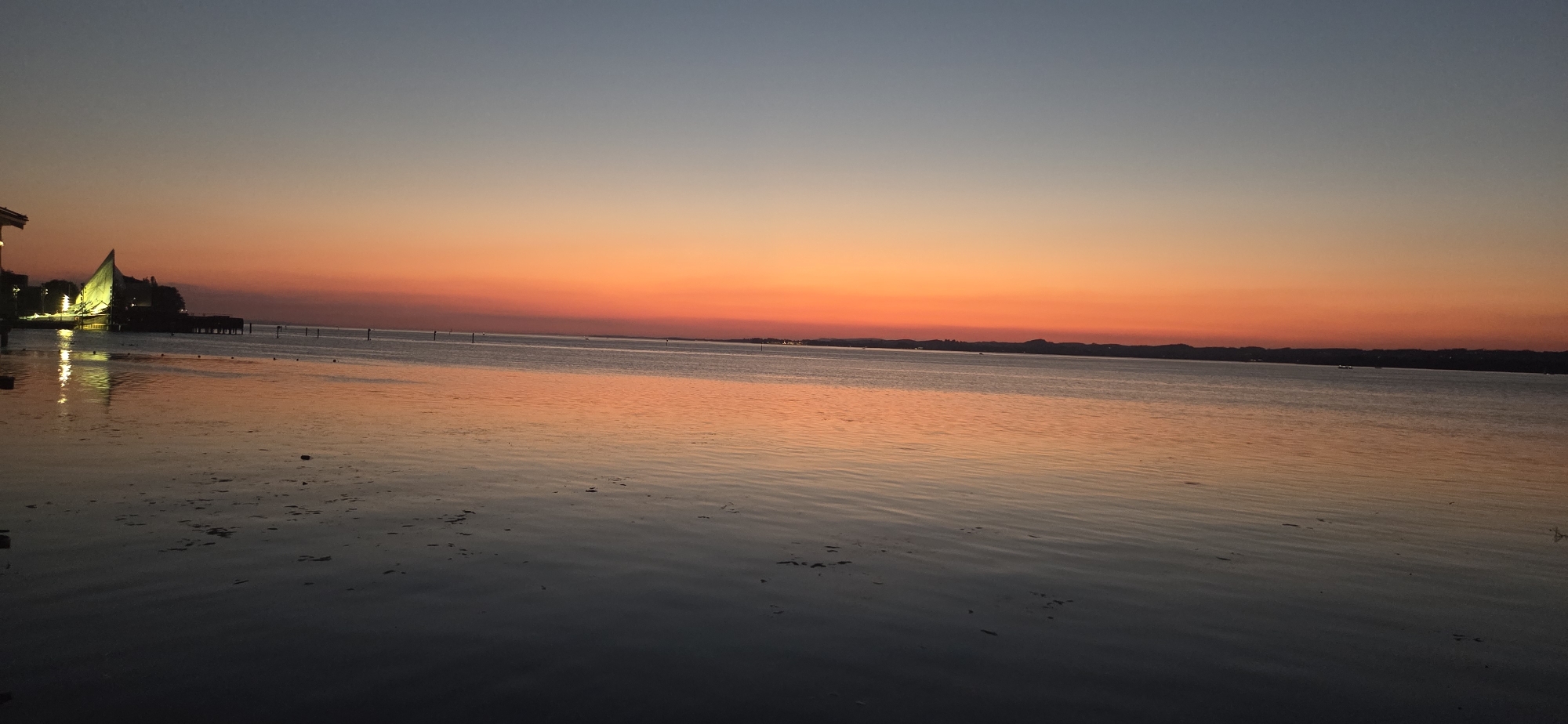 Sunset over Lake Constance, Bregenz — gazebo lights on the water