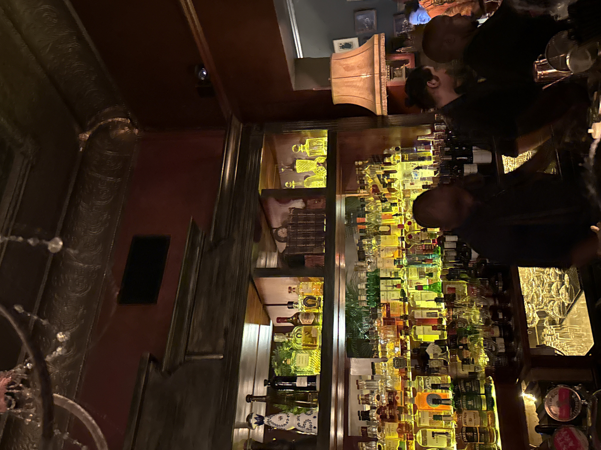Evening social gathering at ornate Cape Town bar documented