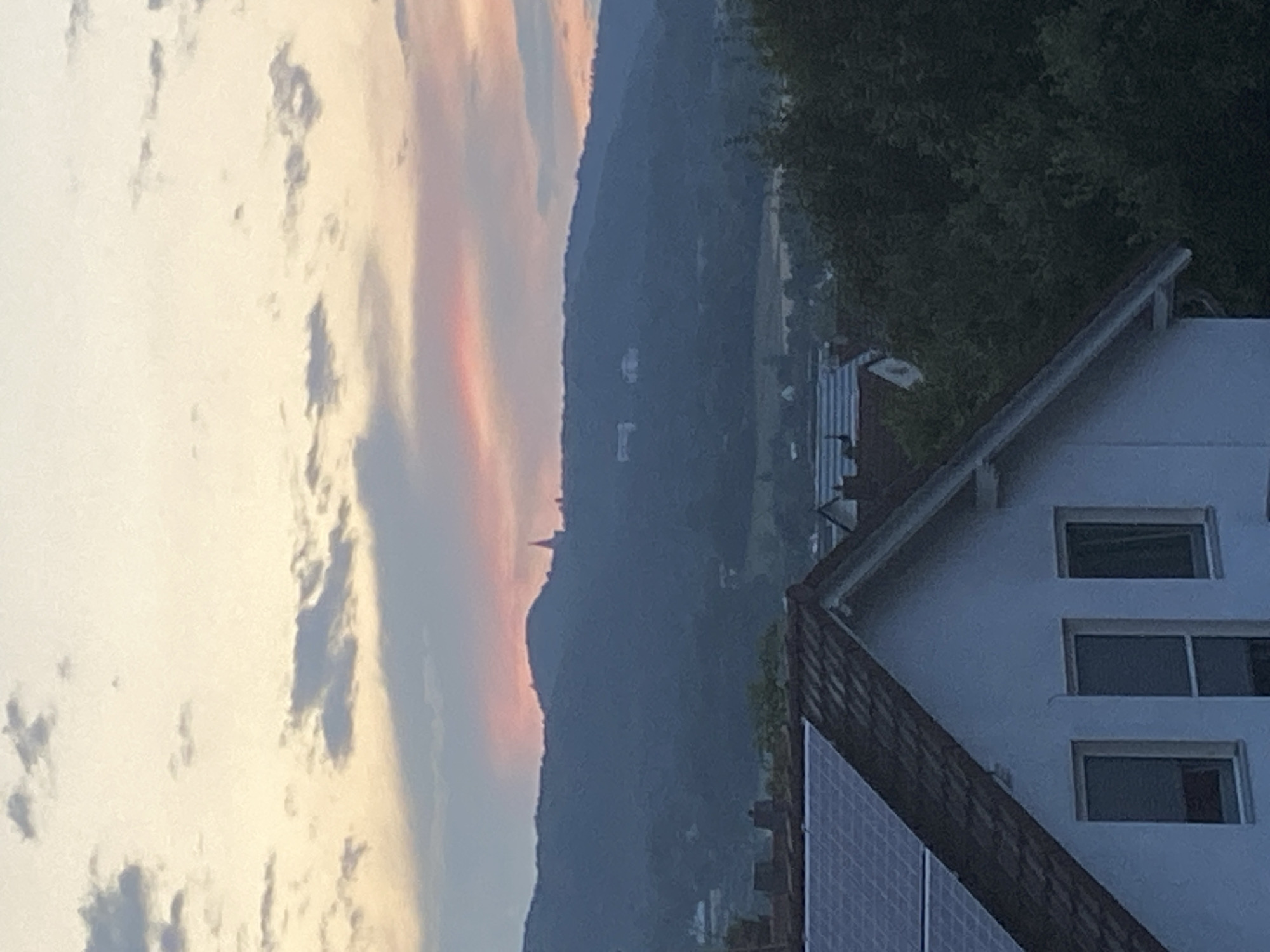 Kassel rooftop and hills at twilight, solar panels in view