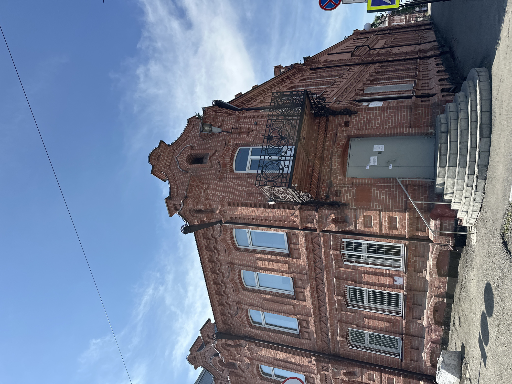 Historic church, red brick buildings, and a carousel in Biysk