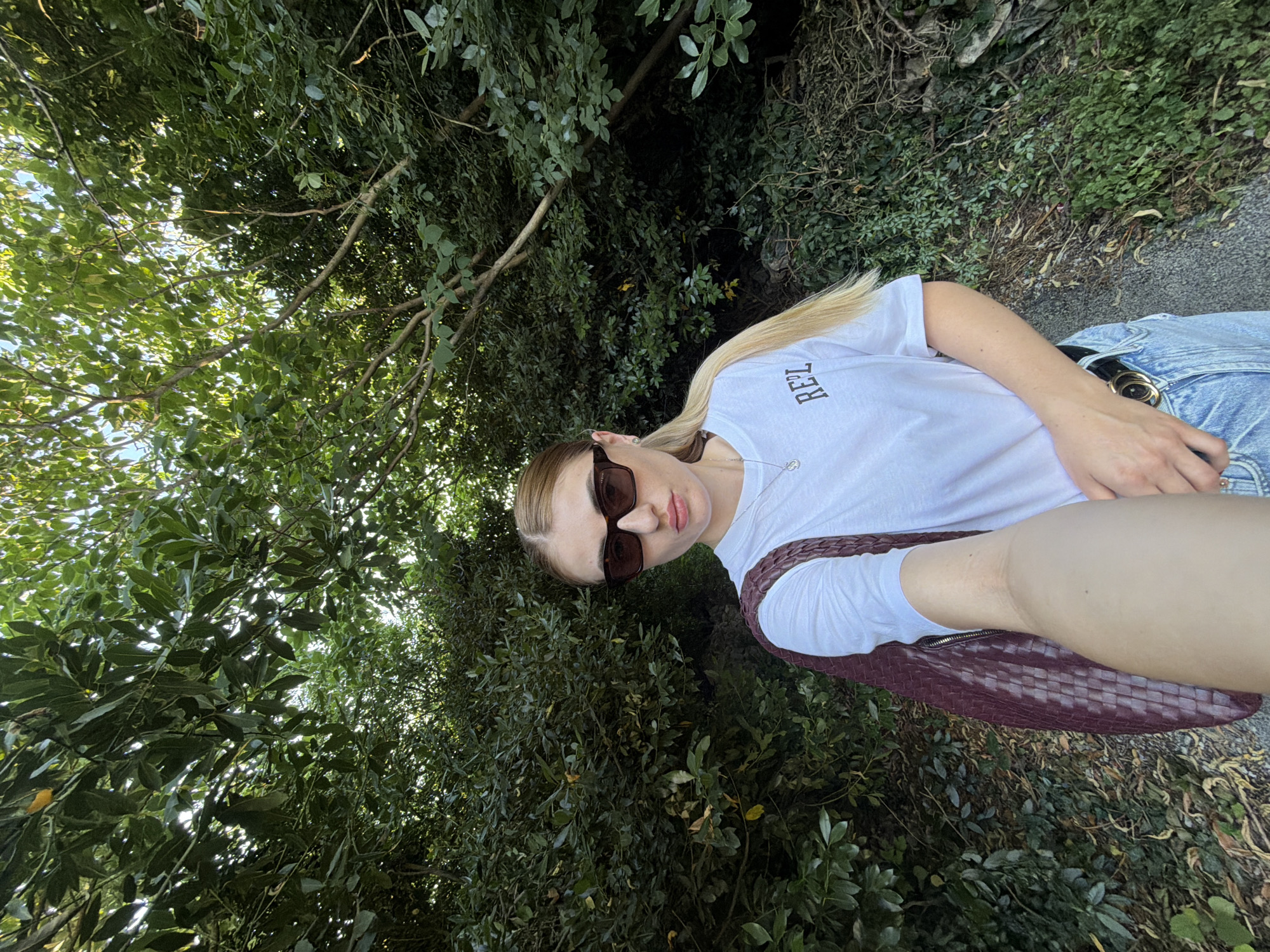Selfie series outdoors, white tee and woven bag