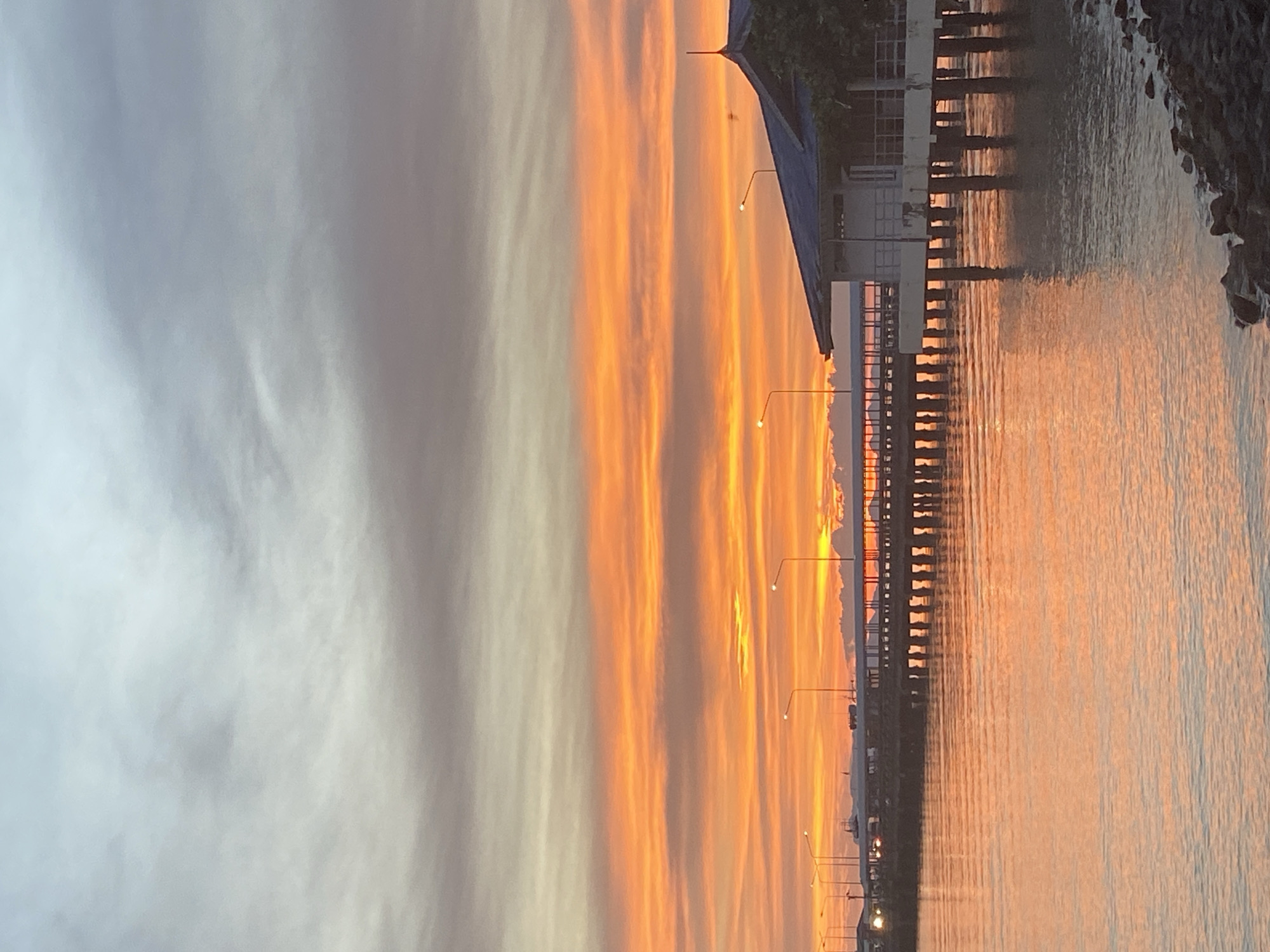 Nathon port at golden hour, ferry docked, sky on fire