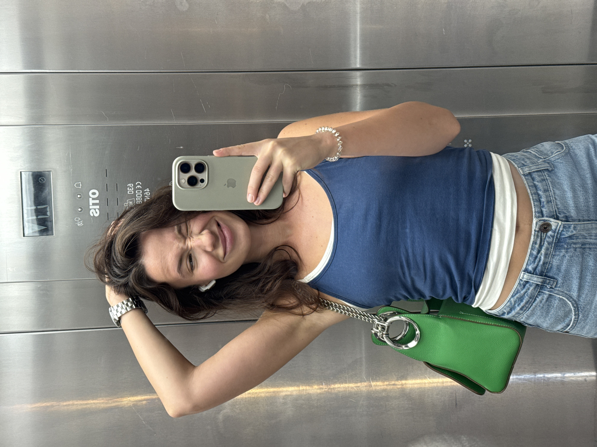 Back-to-back selfies in a Tel Aviv elevator and parking garage.