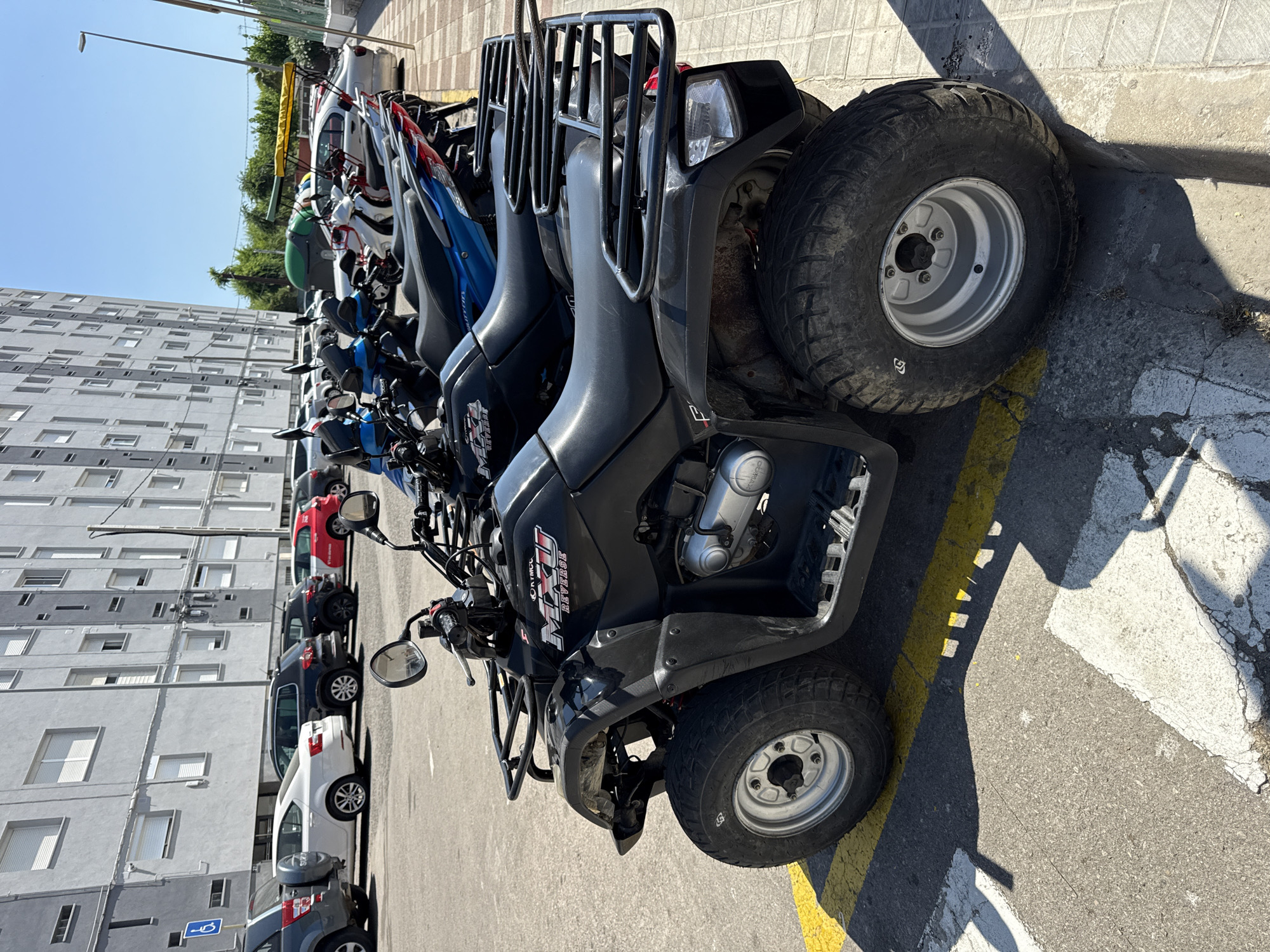 Police presence and rental vehicles on a Blanes summer afternoon