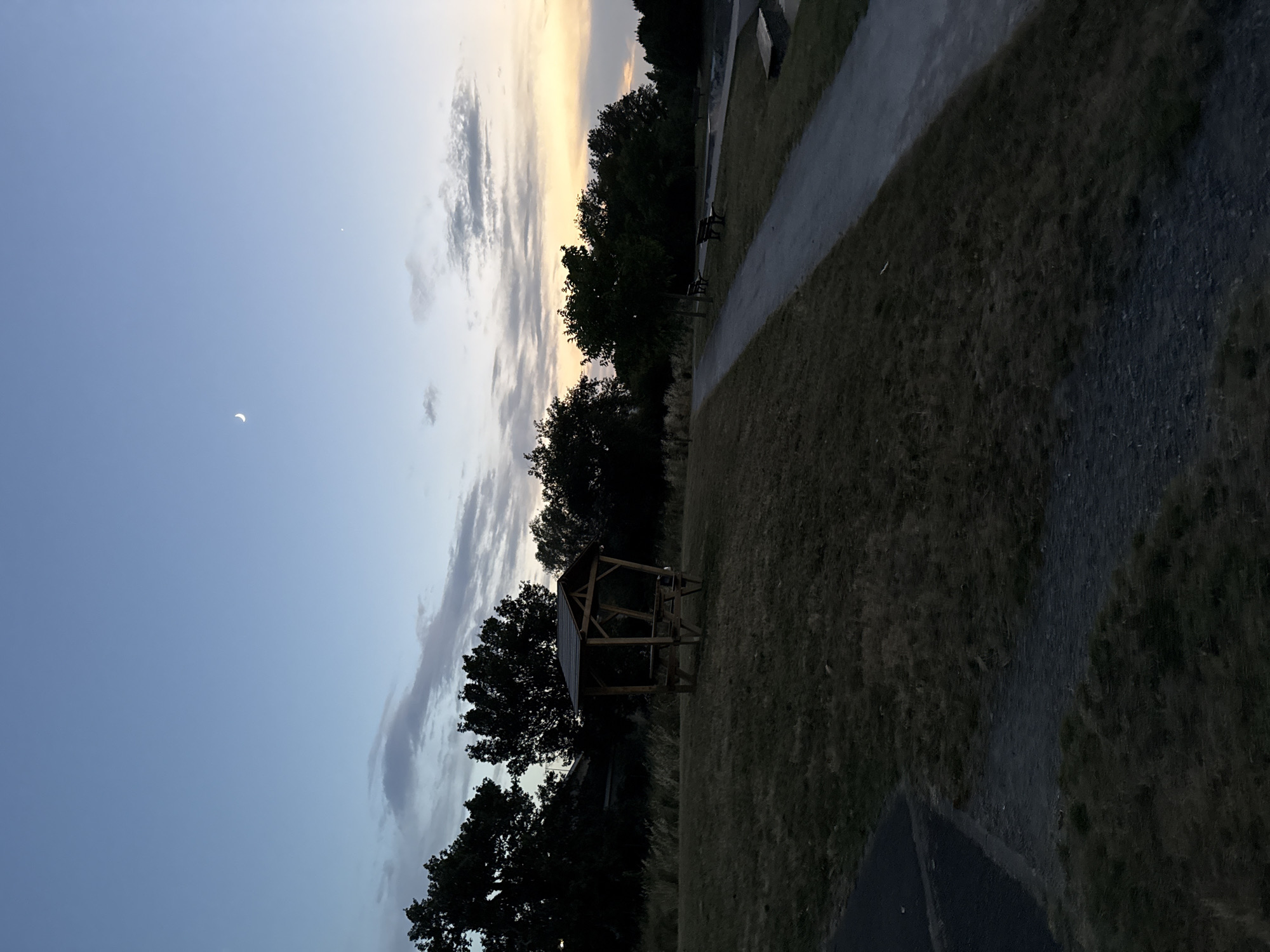 Dusk at a Saint-Orens-de-Gameville park, gazebo and sports fence