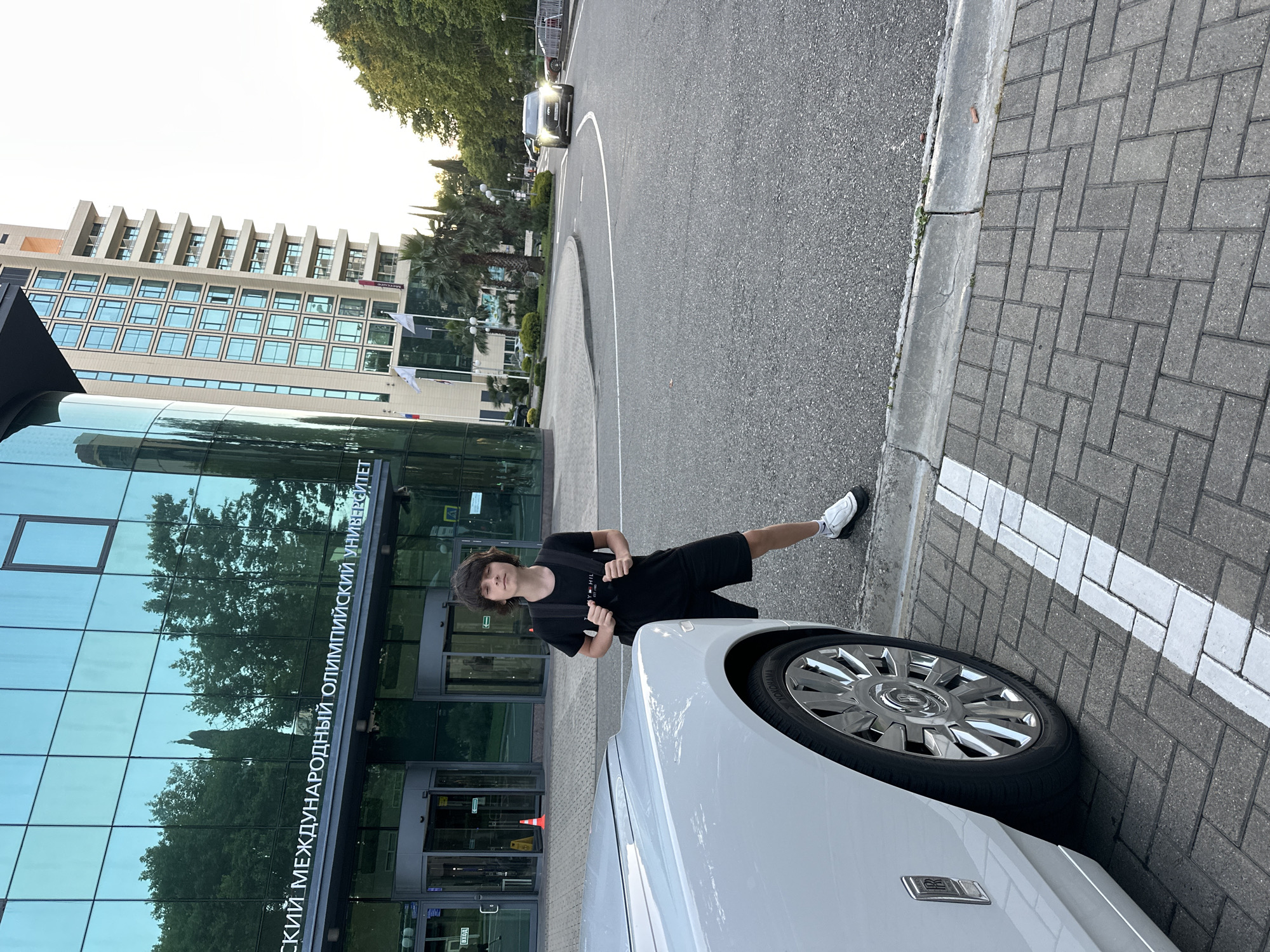 Sochi evening: sunset, seafront dining, and a white Rolls-Royce