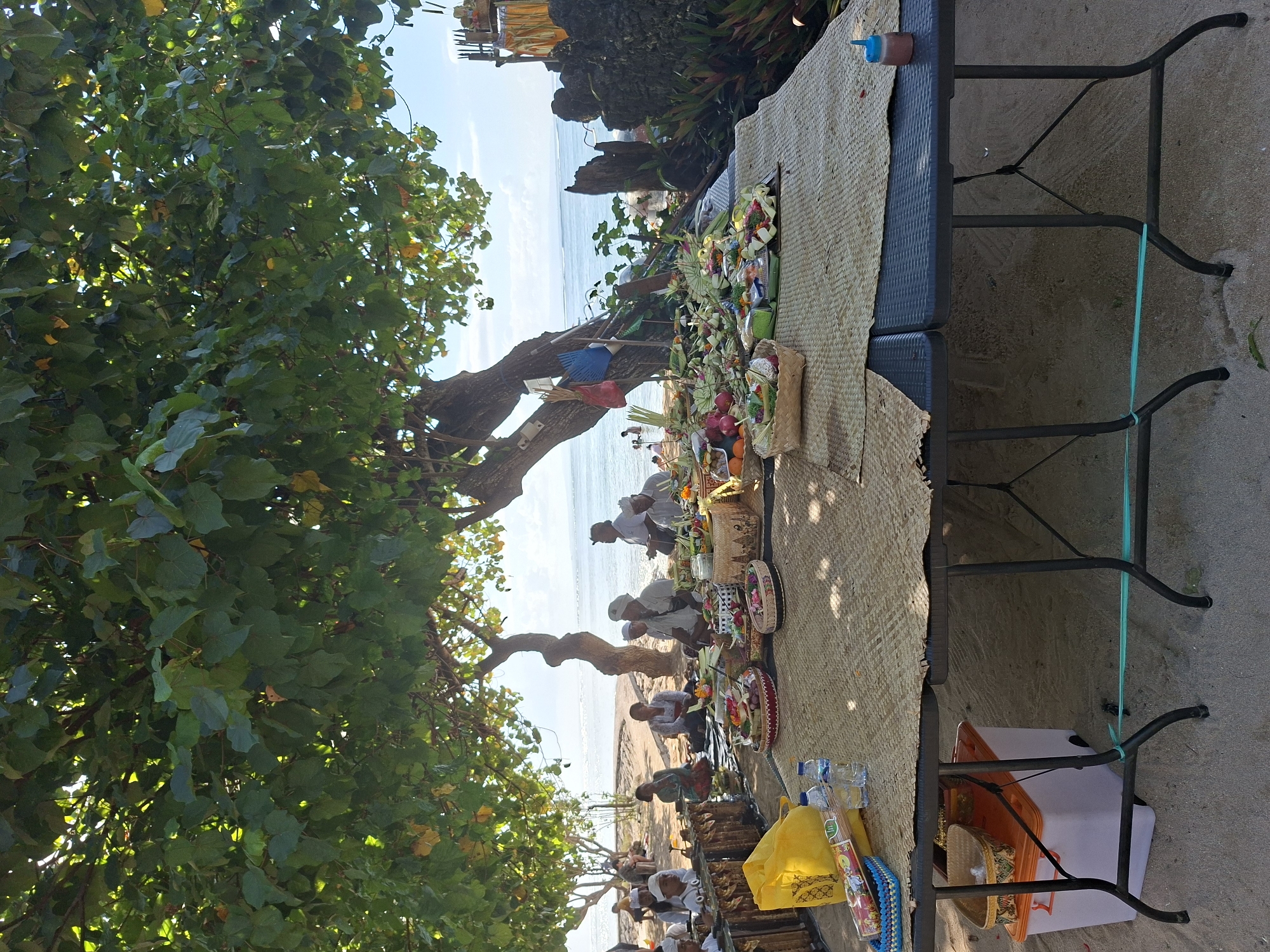 Hindu ceremony held on Denpasar coast with traditional offerings