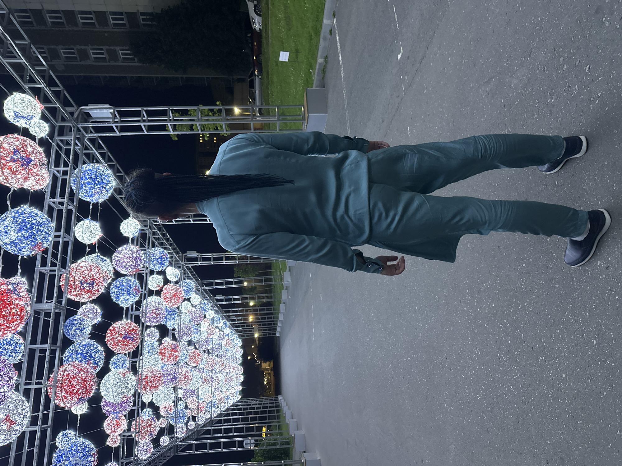 Evening stroll along a festively lit walkway in Saratov