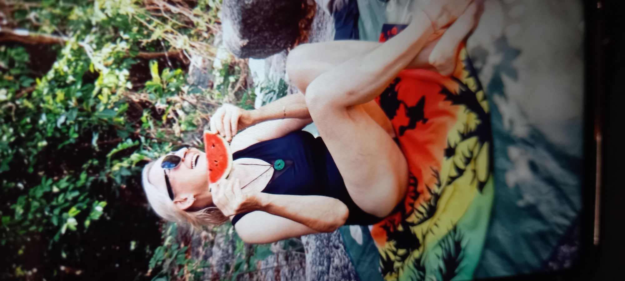 Woman enjoys tropical relaxation with watermelon in Thailand