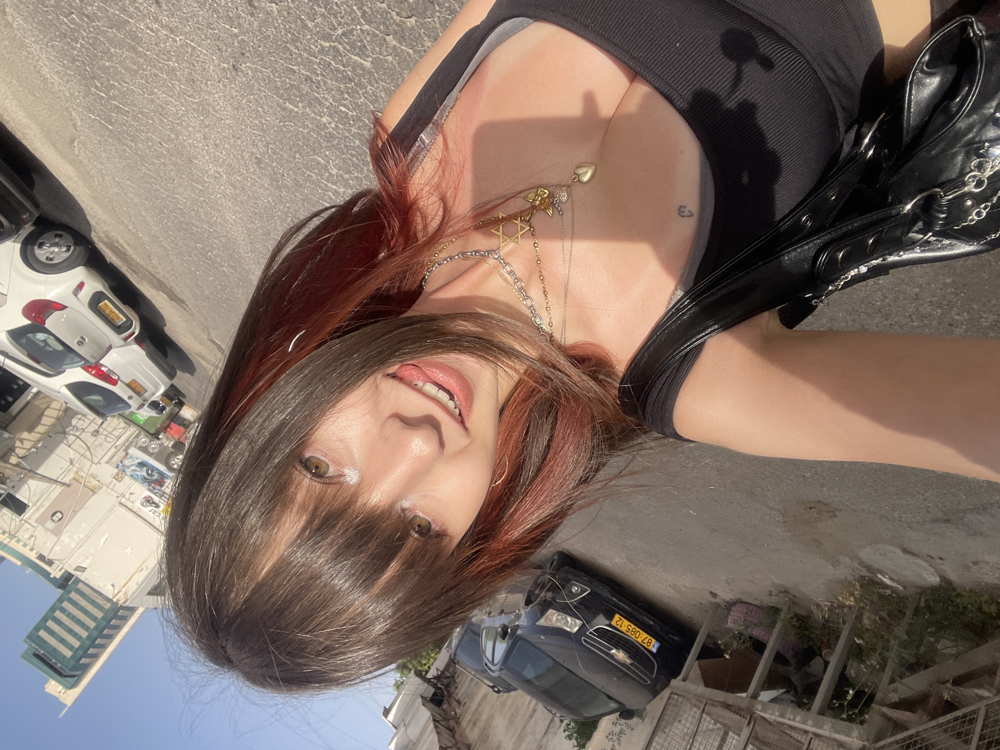 Woman photographs herself around water gardens in Raanana, Israel
