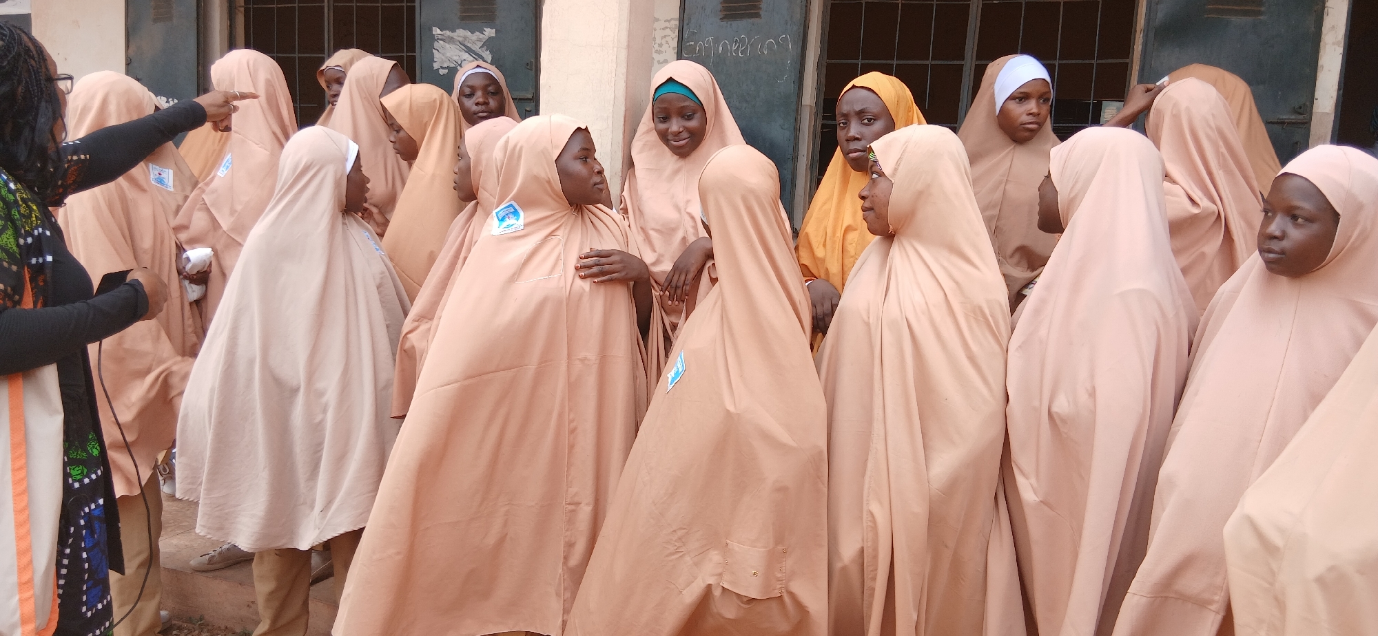 School gathering in Kaduna classrooms, students receiving distributed items