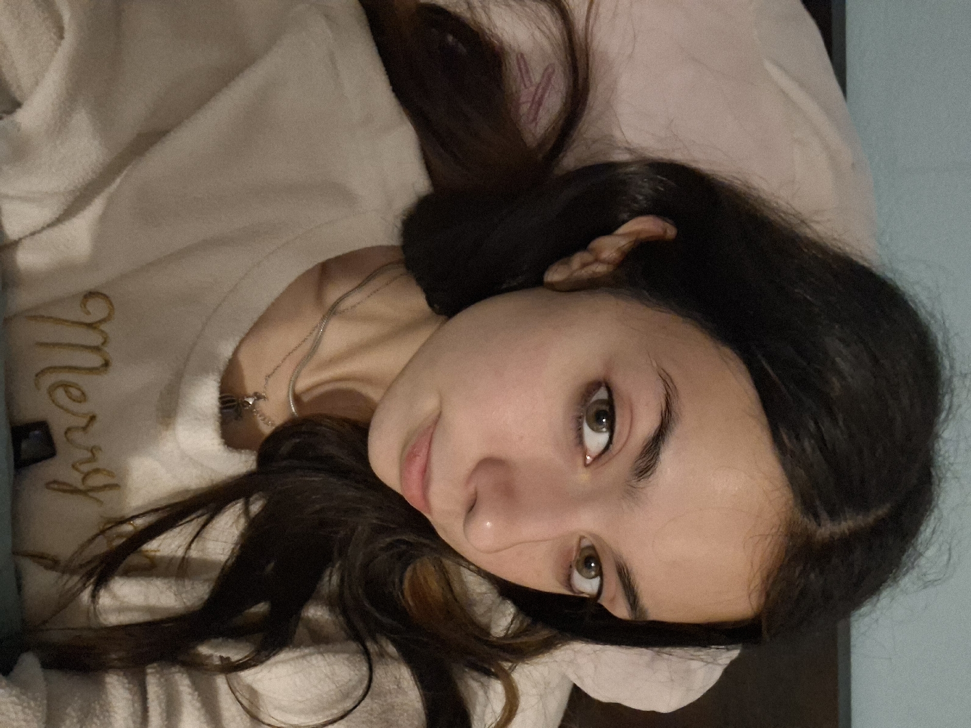 Woman rests on bed in Sofia room