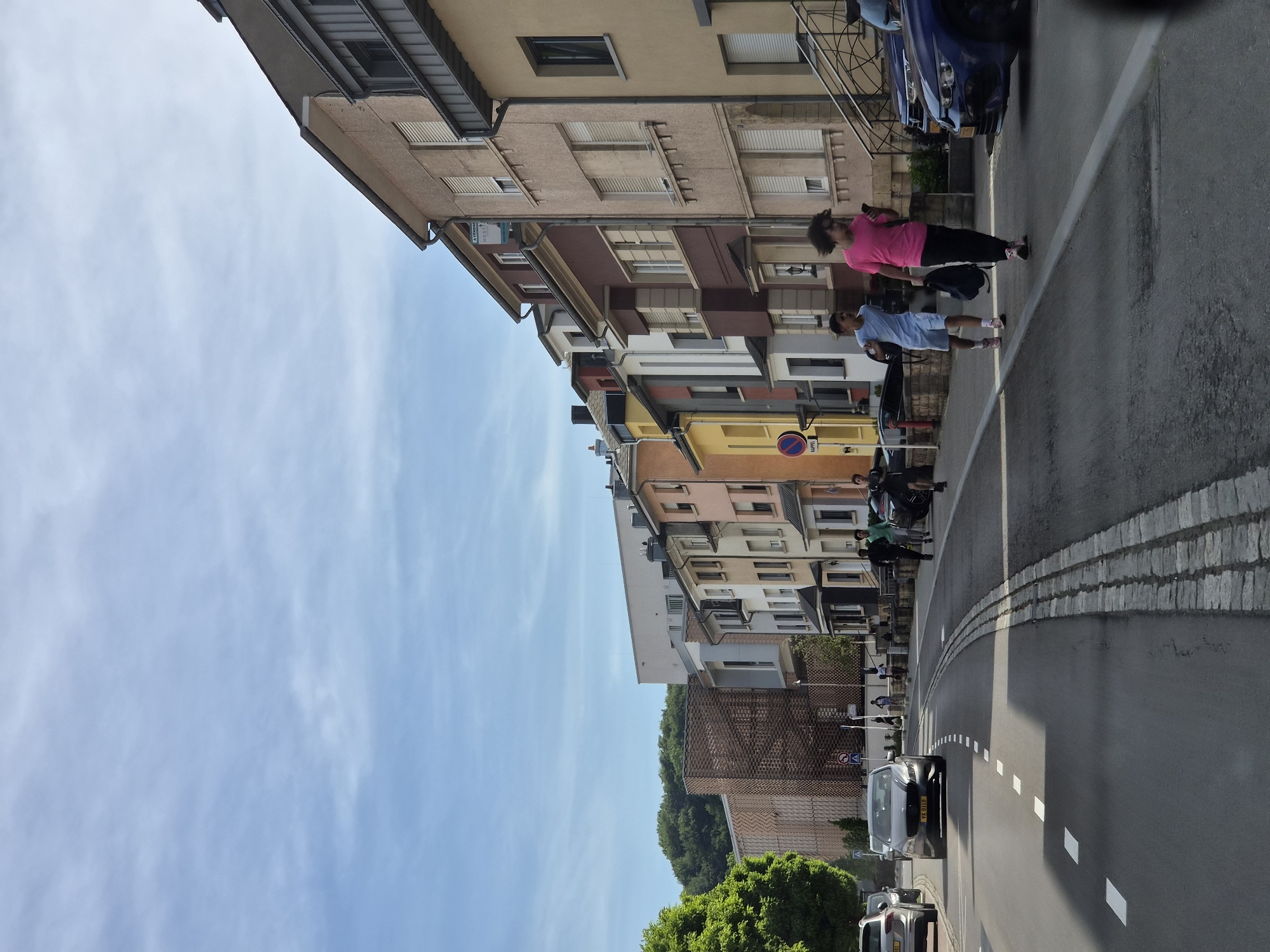 Pedestrians walk Differdange streets on quiet Saturday afternoon