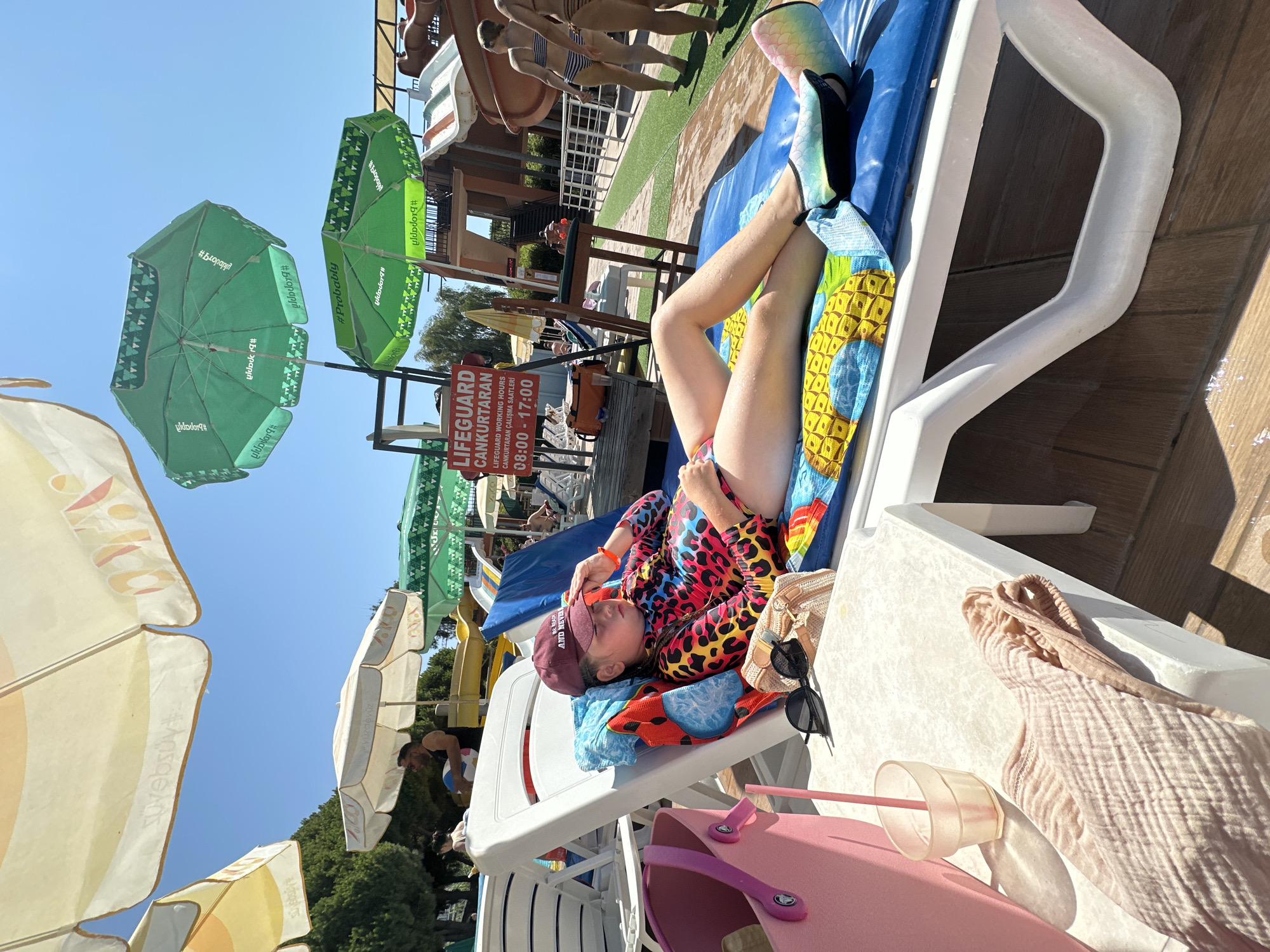 Summer day at an Alanya water park, pool full and sun out.
