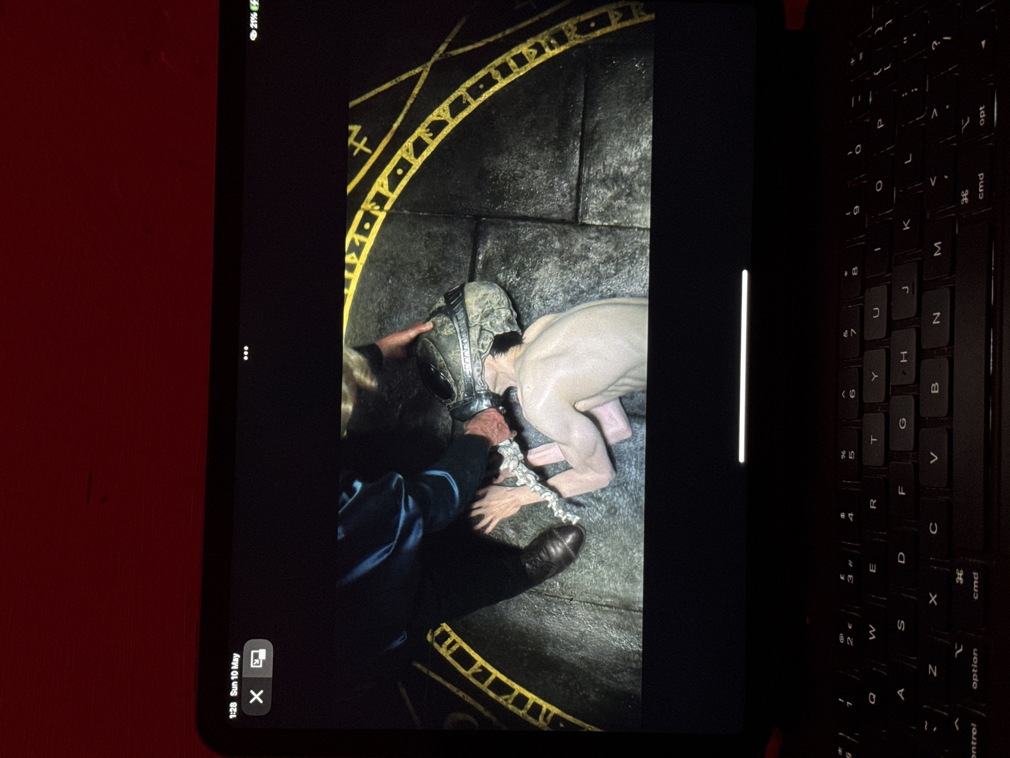 Tablet displays helmet scene in Sofia office setting