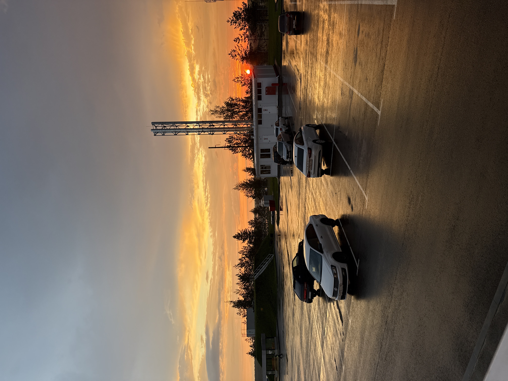 Vivid post-rain sunset over a Sarapul parking area