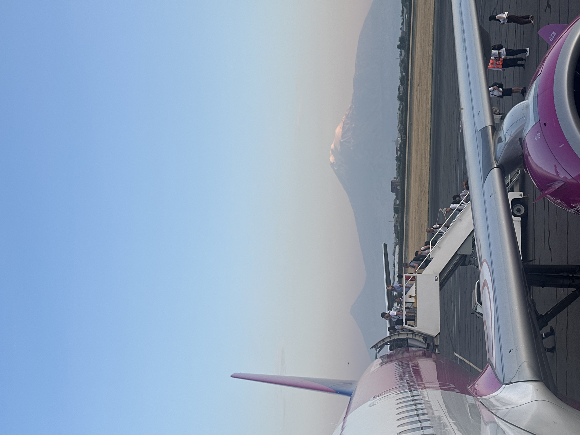 Wizz Air's pink livery up close on the tarmac