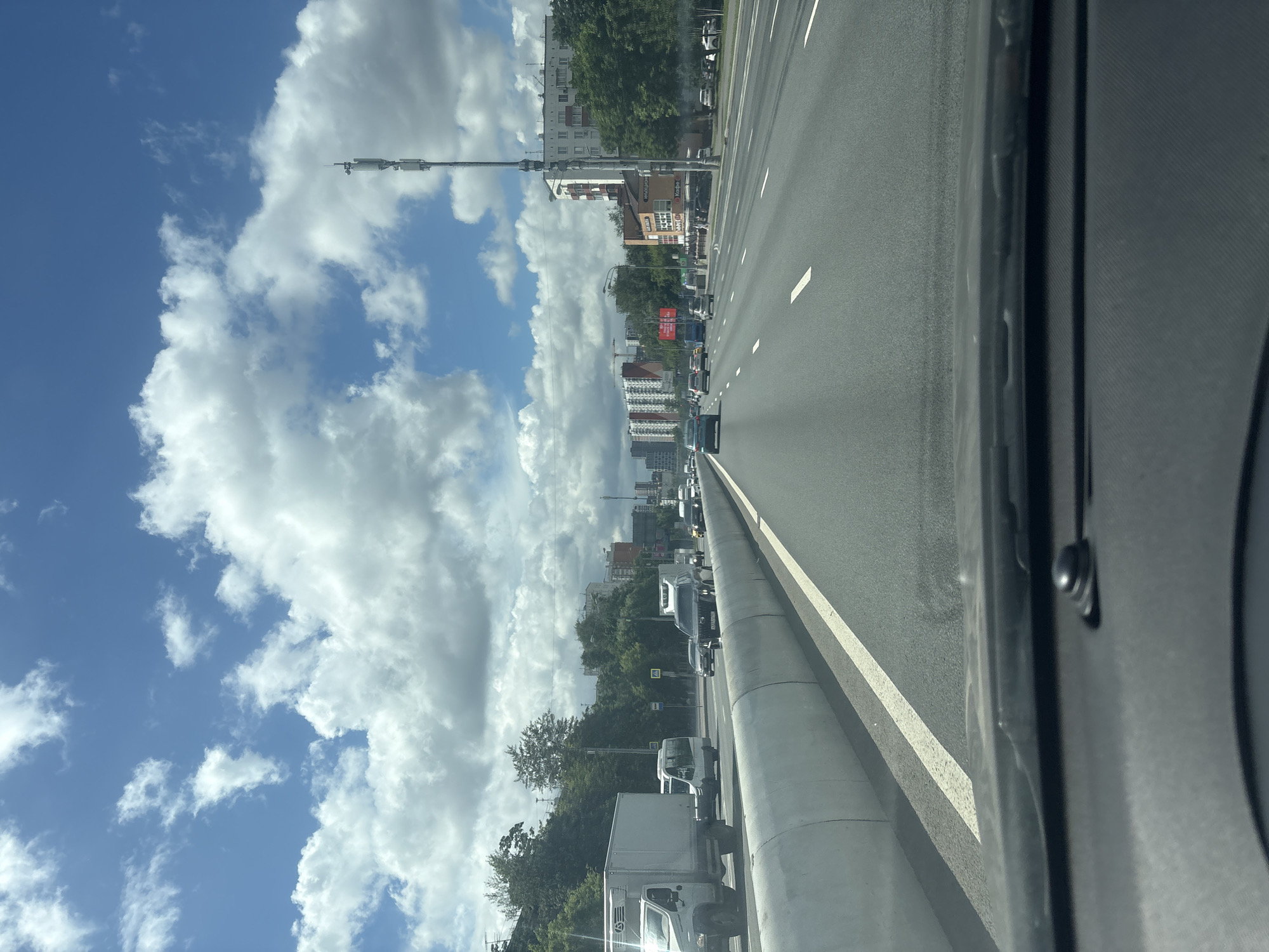 Highway traffic on a Moscow road, shot from inside a vehicle.
