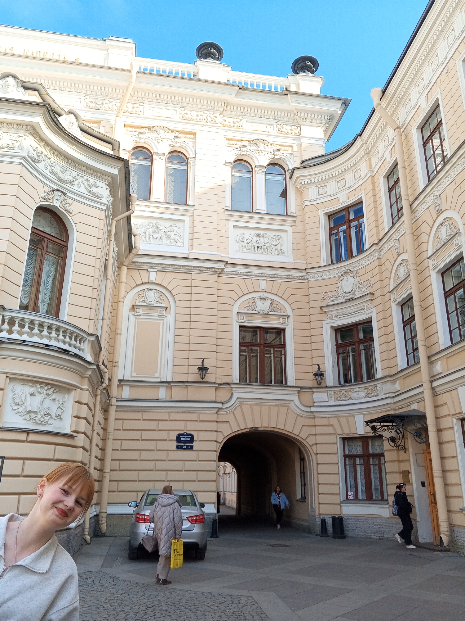 Saint Petersburg scenes: ornate architecture and young women