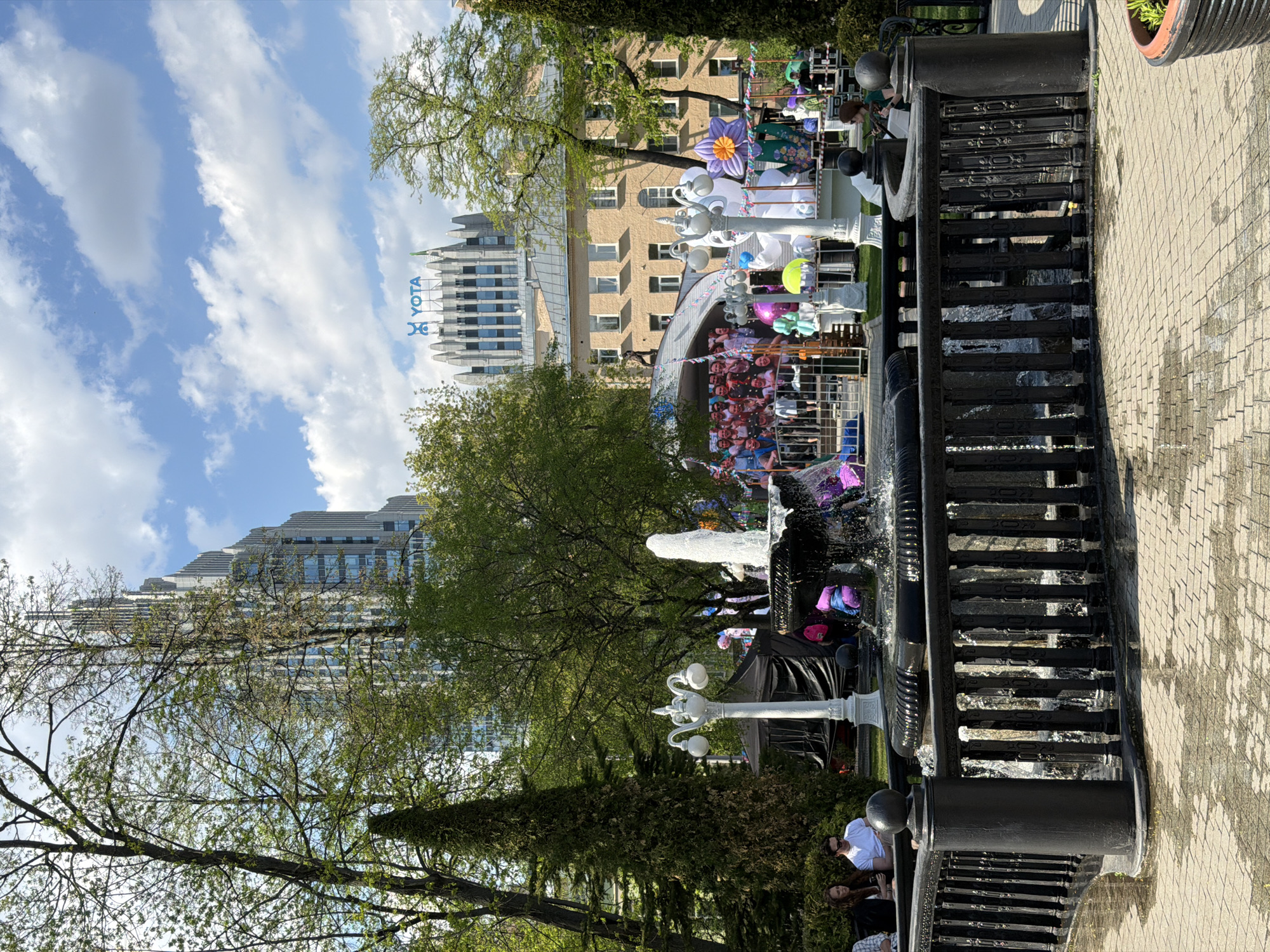 Moscow park view features prominent Yota building backdrop
