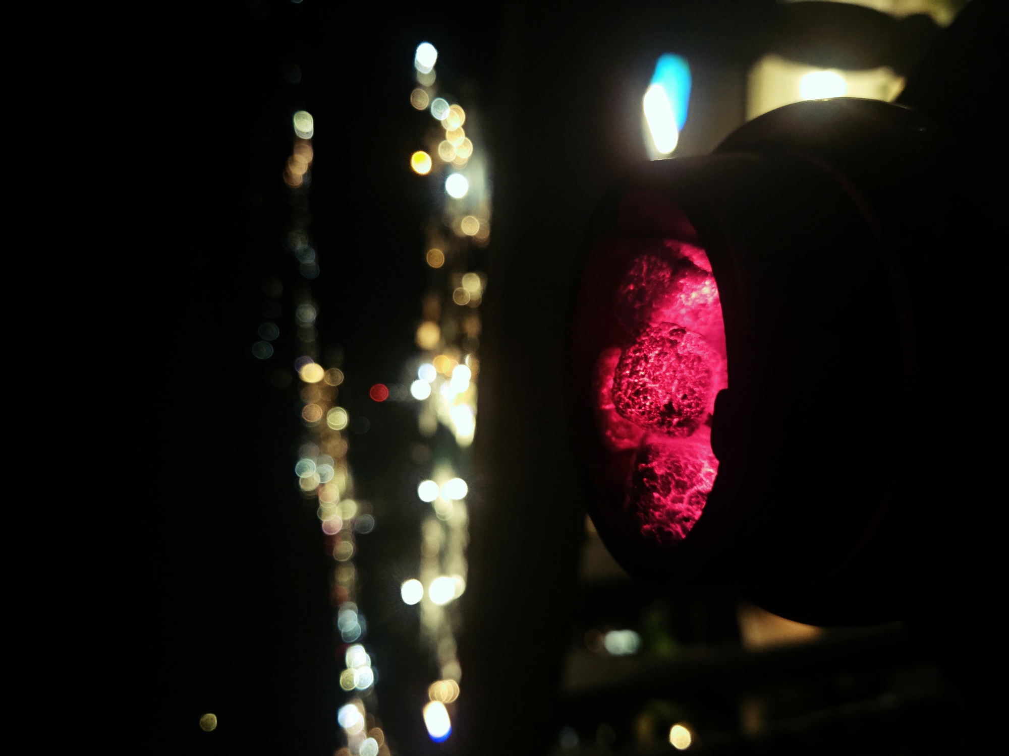 Evening hookah session on city balcony overlooking waterfront lights
