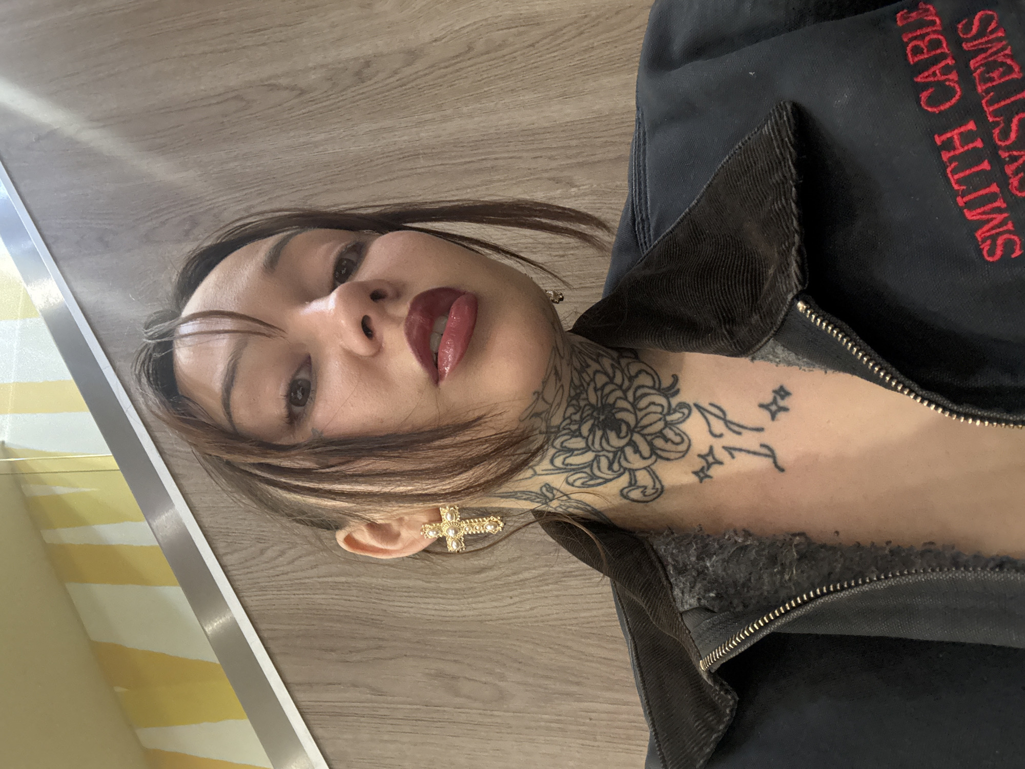 Woman takes high-angle selfie on wooden floor in London
