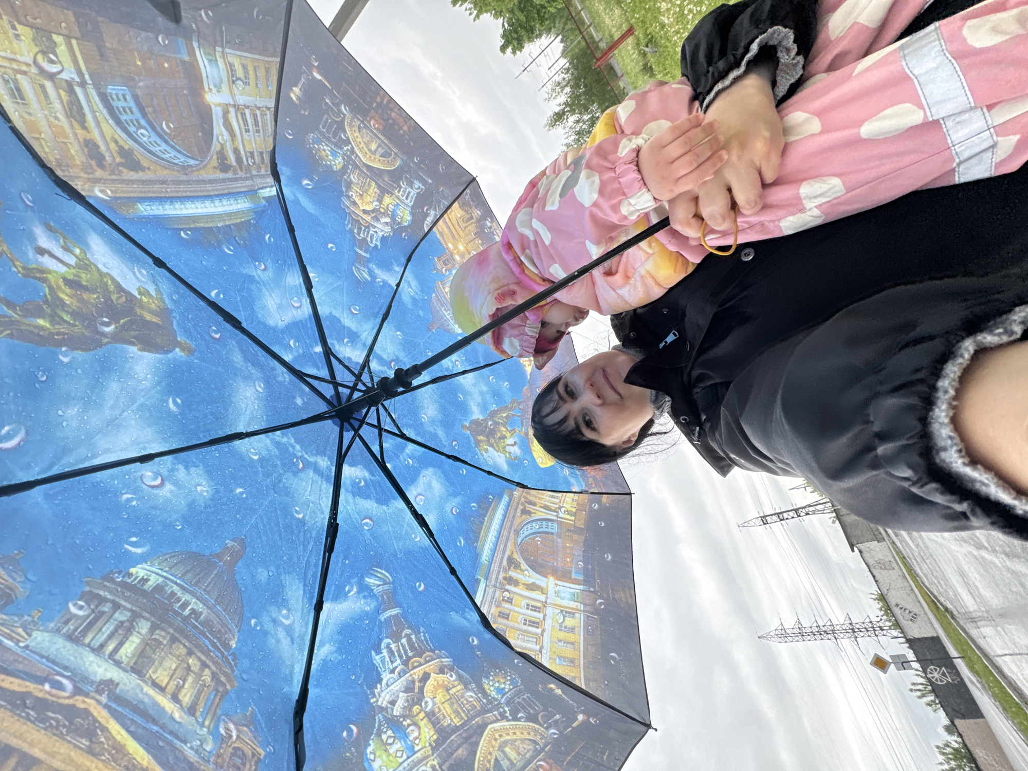 Mother, child pose with St. Petersburg umbrella in Zav'yalovo