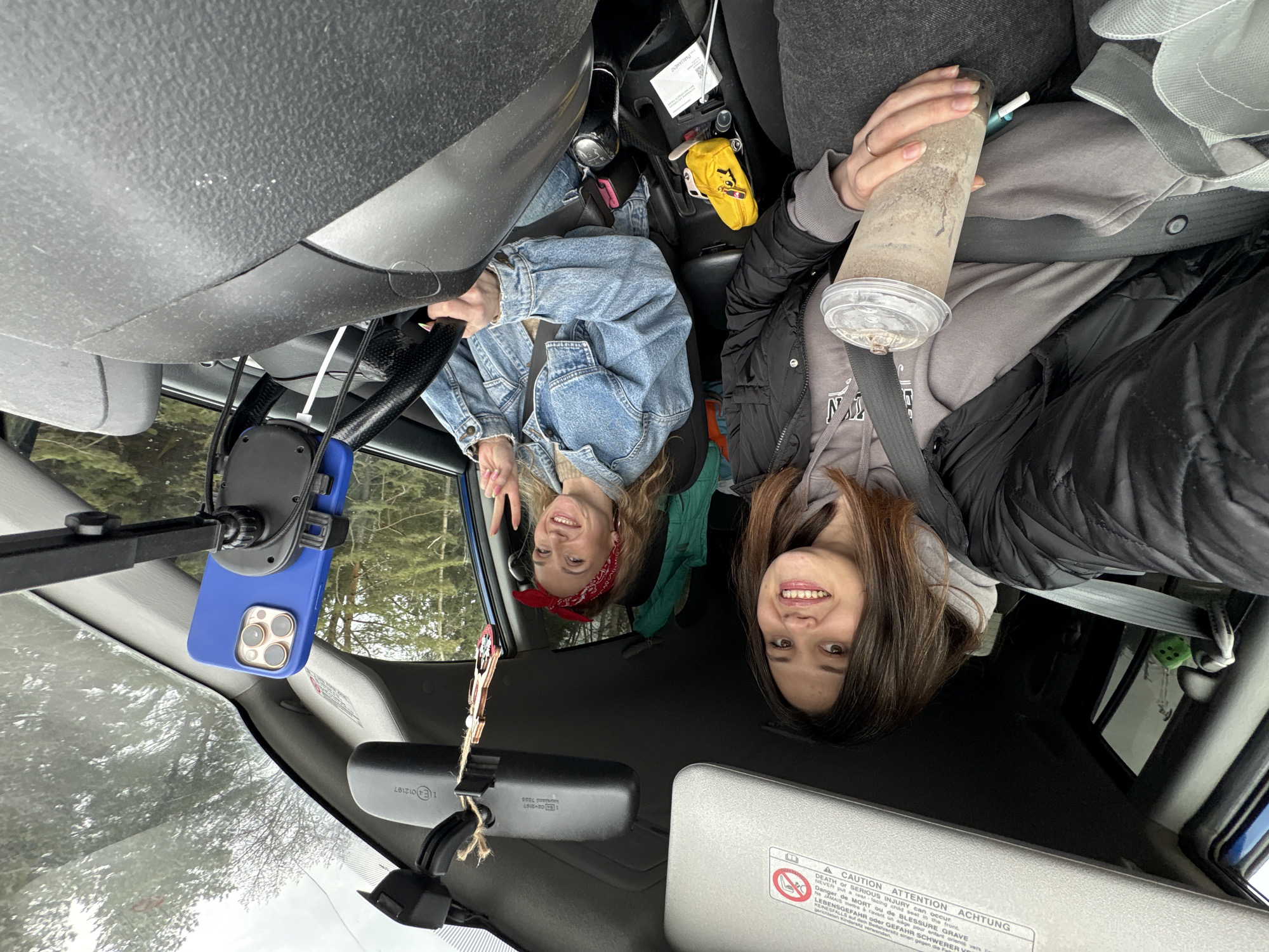 Two women pose in car in Chaikovsky, Russia