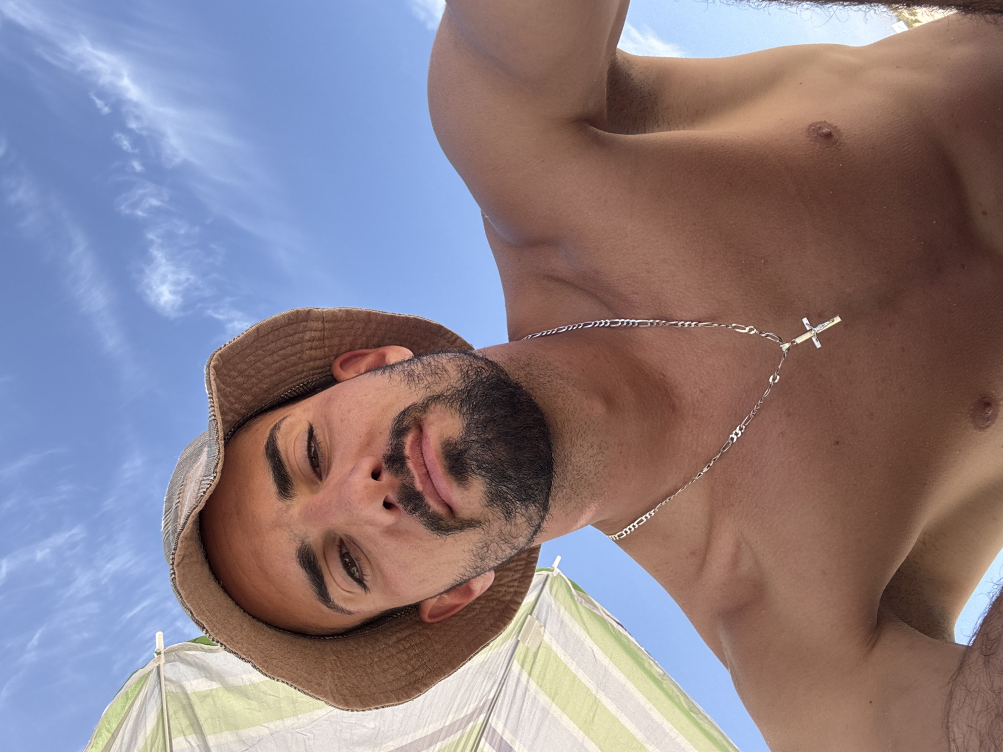 Beach day captured: man in bucket hat, shoreline scenes, outdoor dining