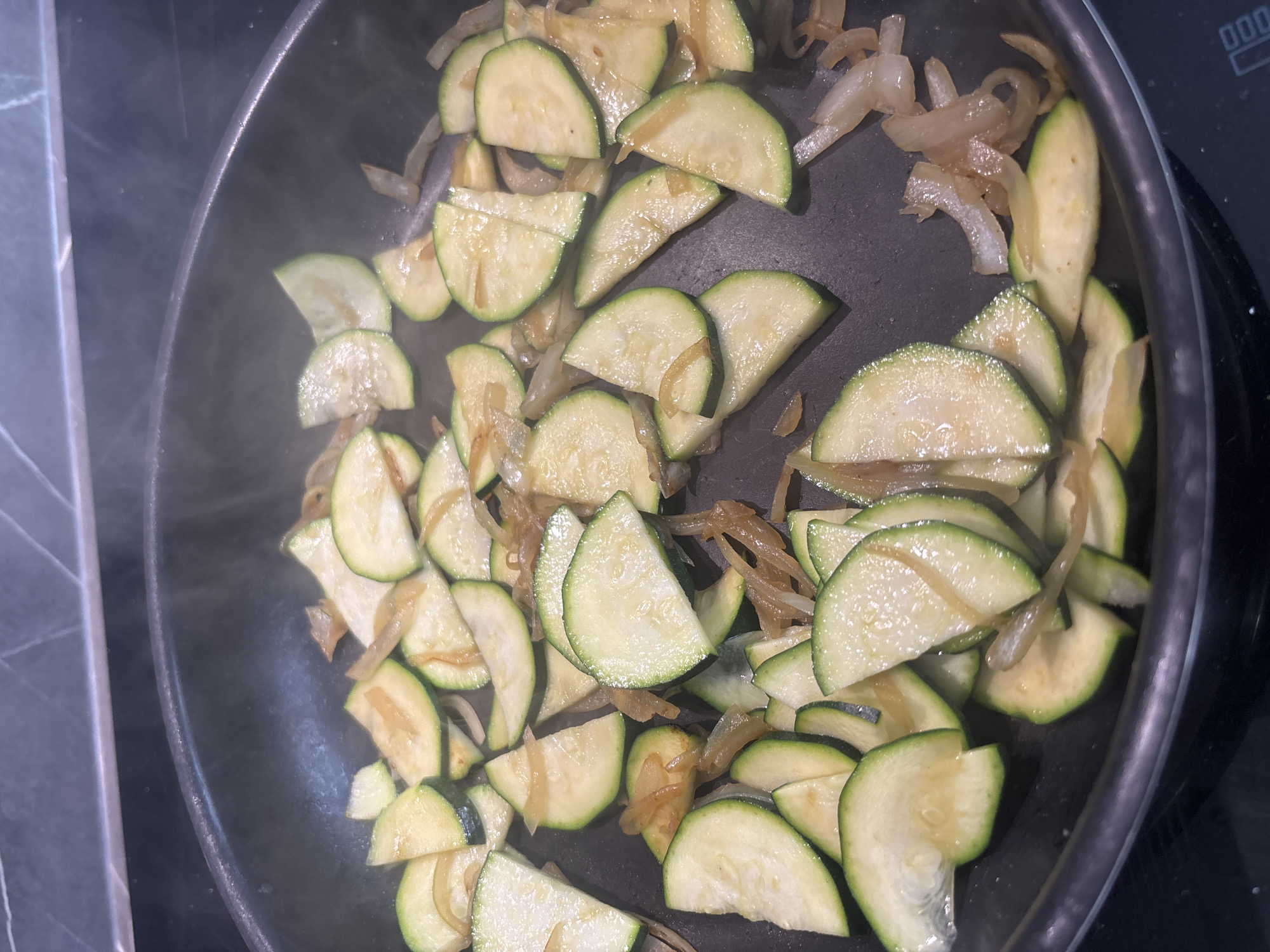 Home cooking session with zucchini and onions in Zagreb