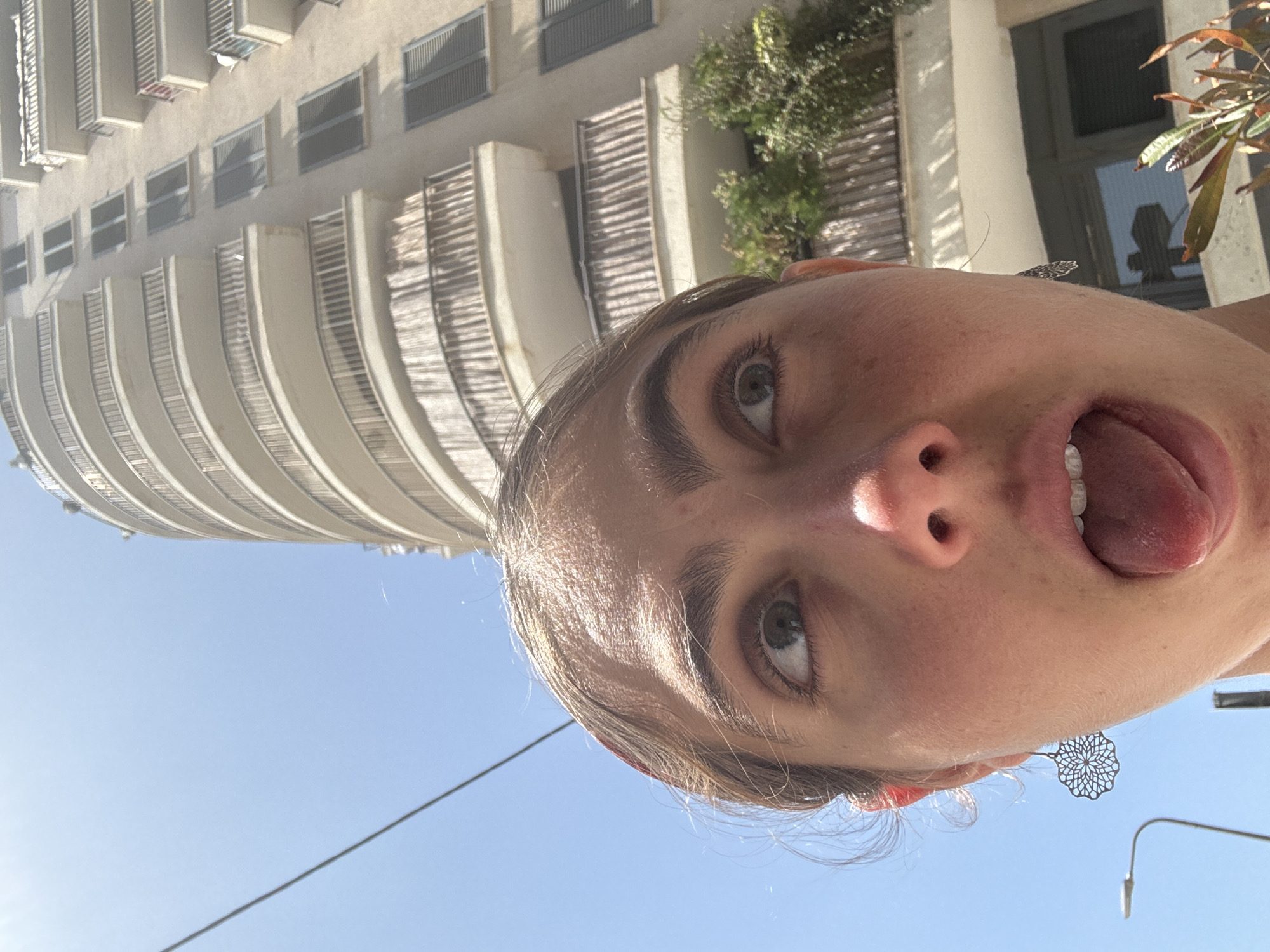 Woman documents morning moments in Tel Aviv street scene
