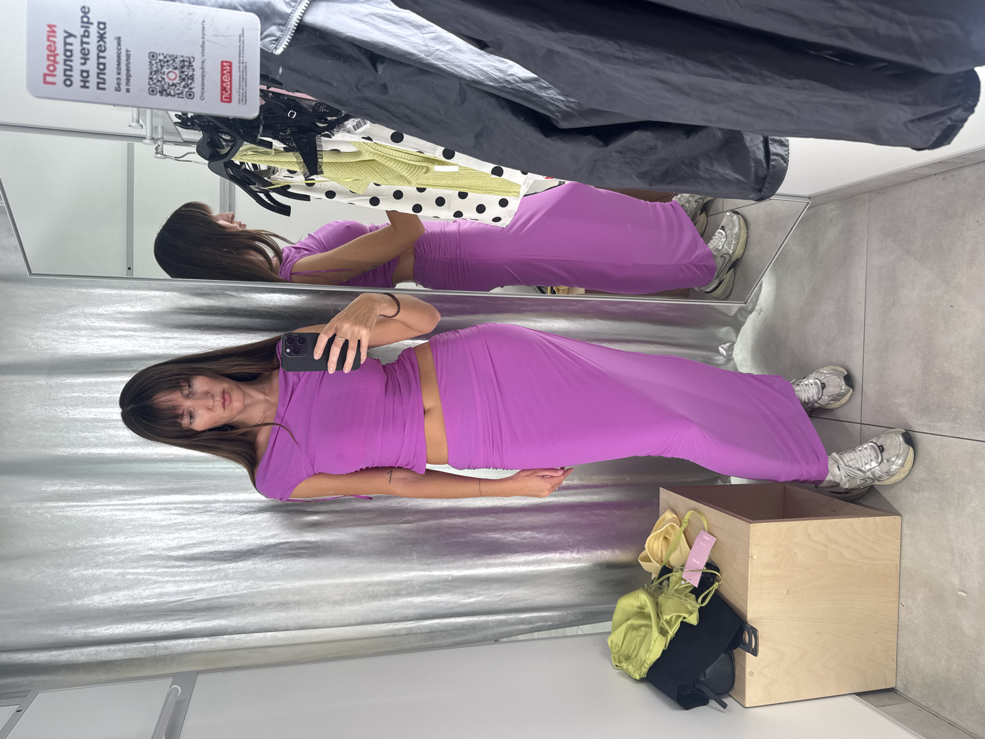Fitting room try-on session in Khimki, mixing purple and green