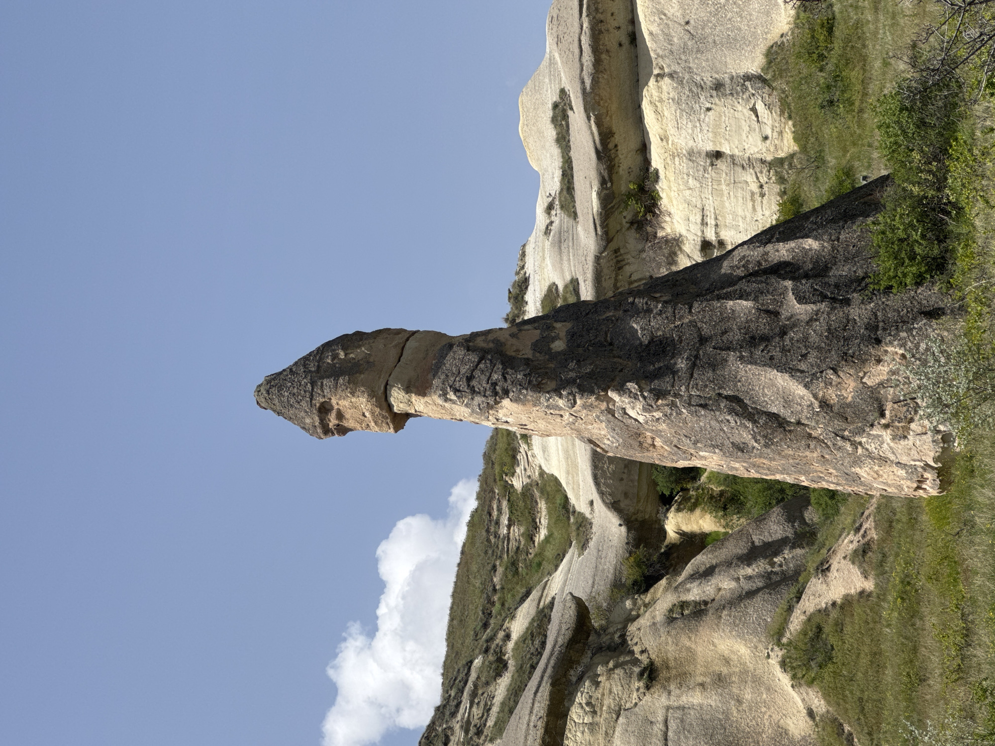 Tourist documents Cappadocia's fairy chimneys in Avanos, Turkey