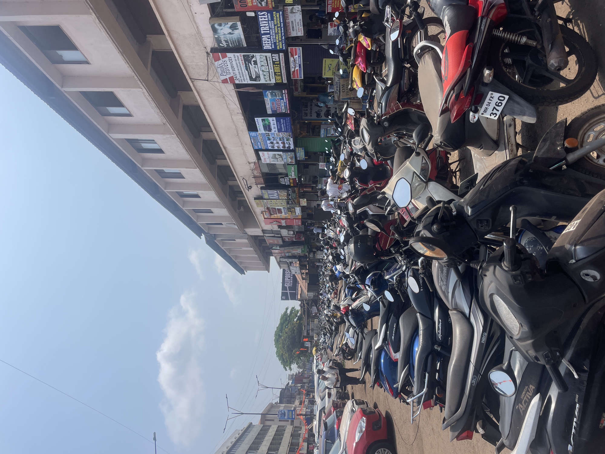 Motorbikes crowd street scene in Mapusa, India