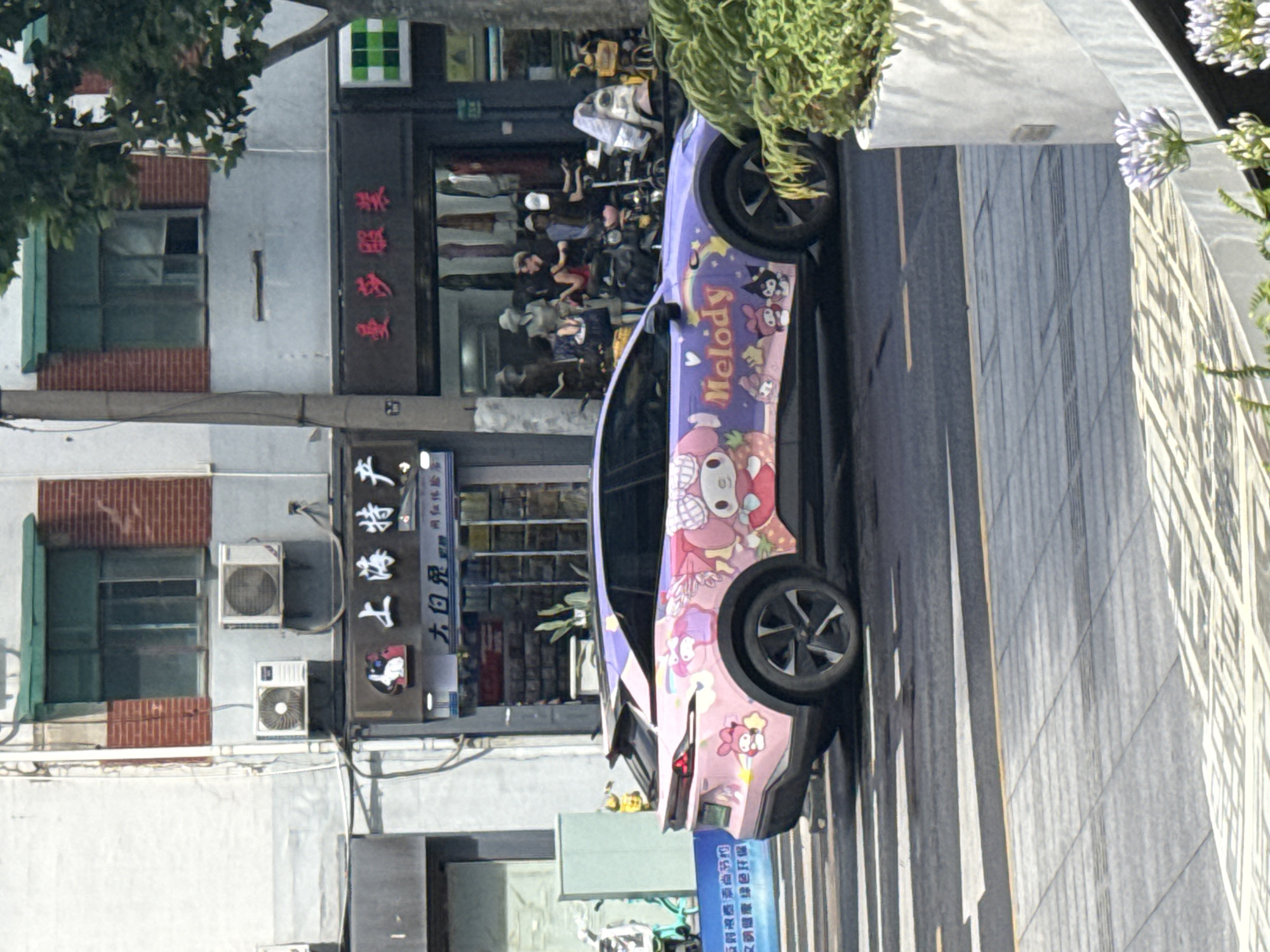 Sanrio-wrapped car spotted in Shanghai with bubble-blowing passenger