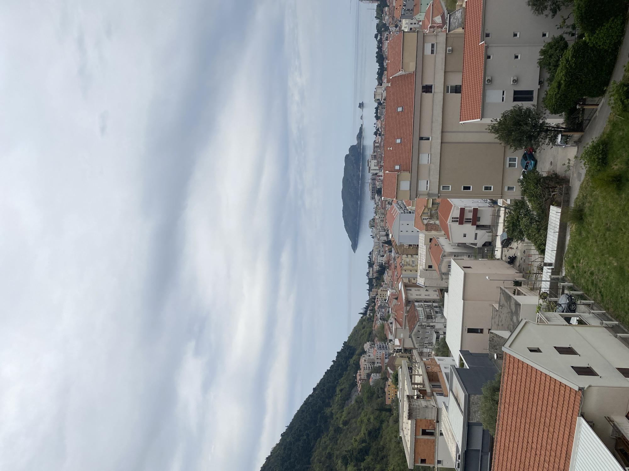 Elevated views captured of Budva's red-roofed coastal cityscape