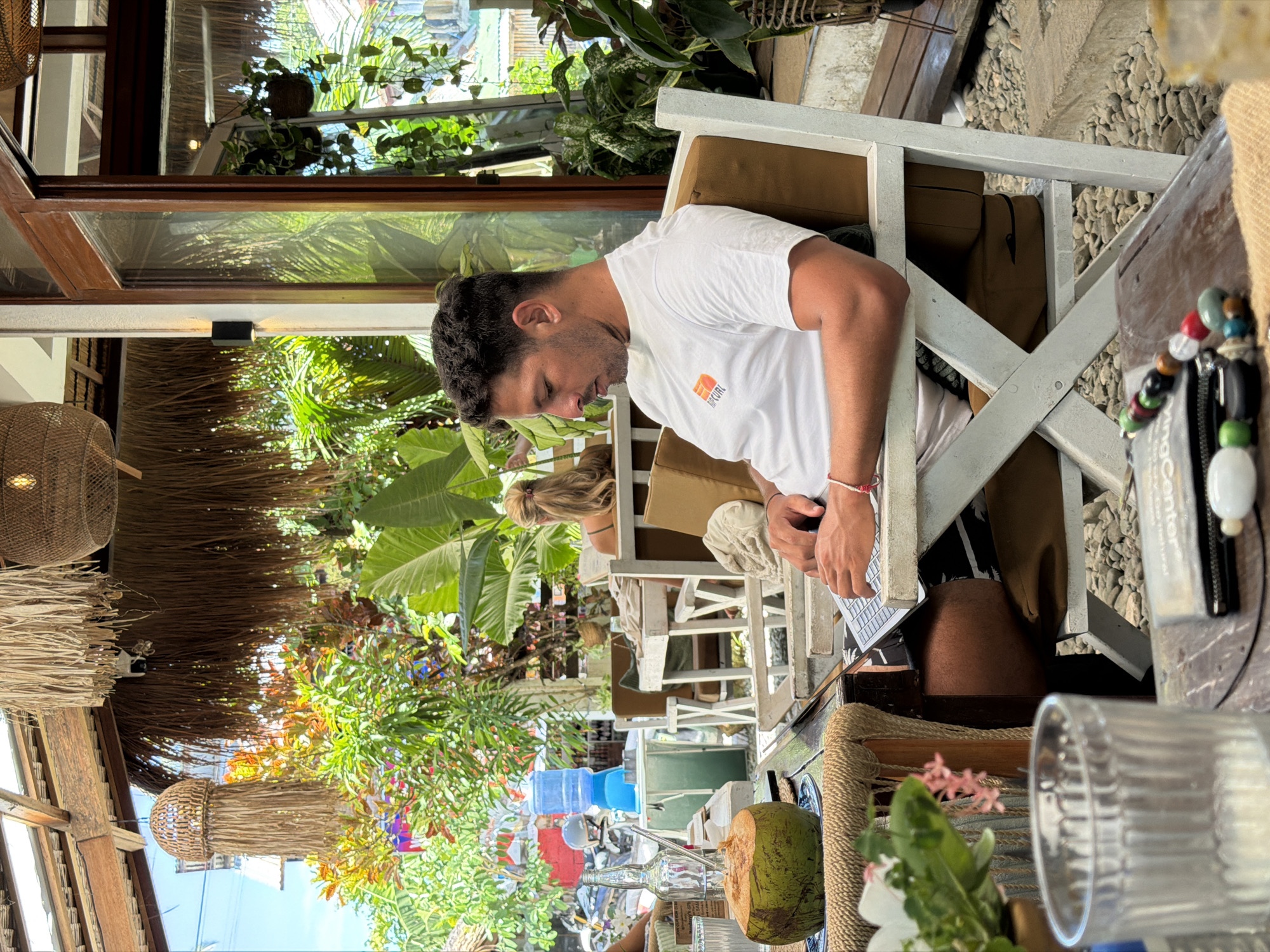 Man dines at outdoor cafe in General Luna, Philippines