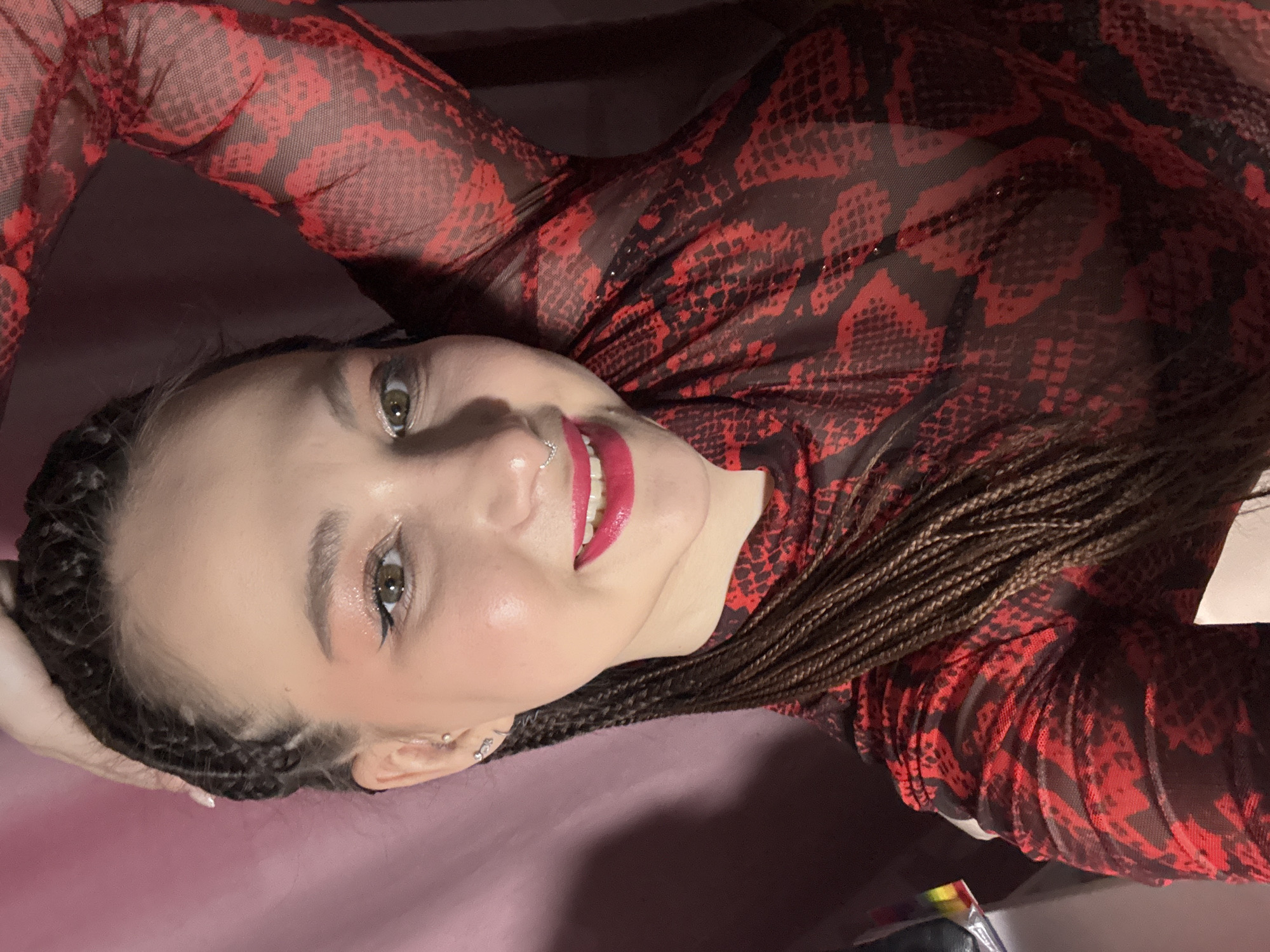 Woman takes selfies in red snakeskin top in Saratov