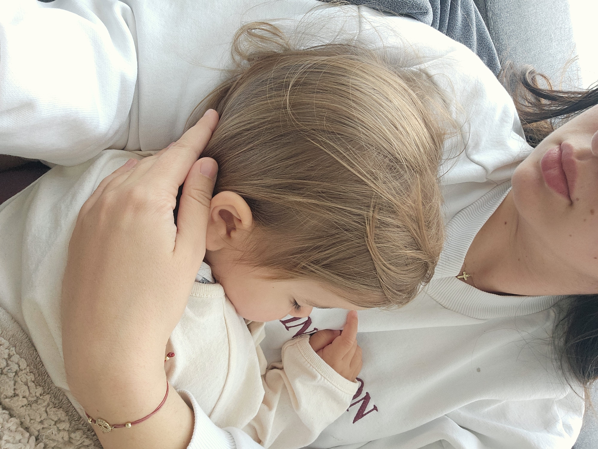 Mother and child share quiet moment in Pomorie home