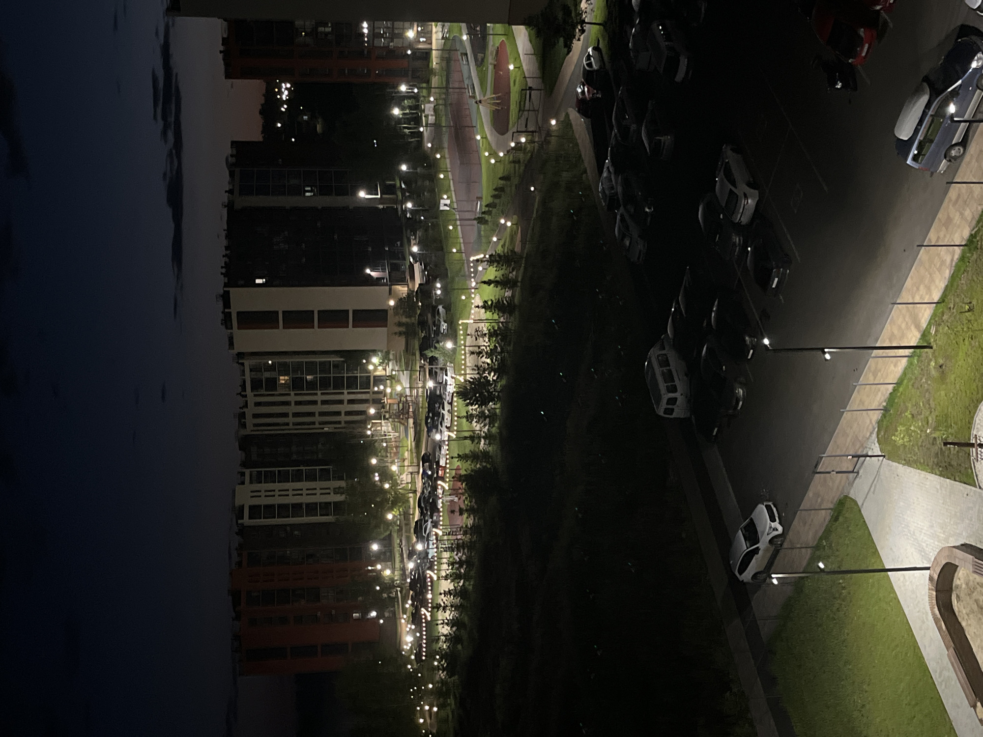 Modern Chelyabinsk apartment complex at night, multiple angles