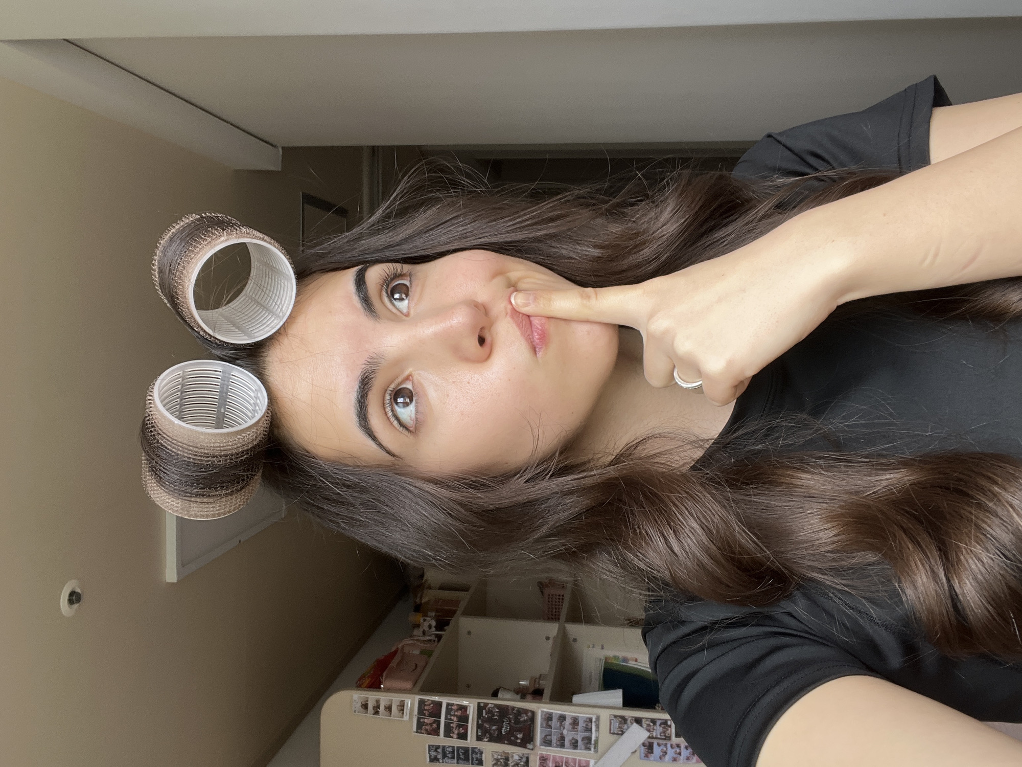 Woman takes late-night selfies with hair rollers in Daegu bedroom
