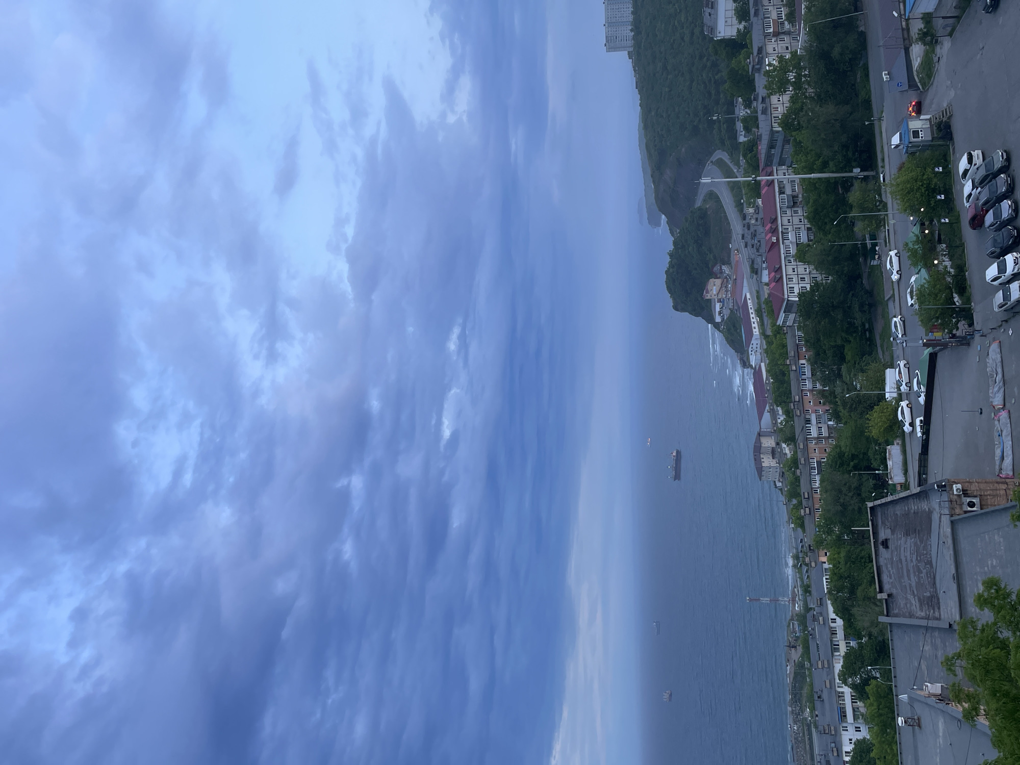 Overcast skies blanket Vladivostok's coastal panorama during morning hours
